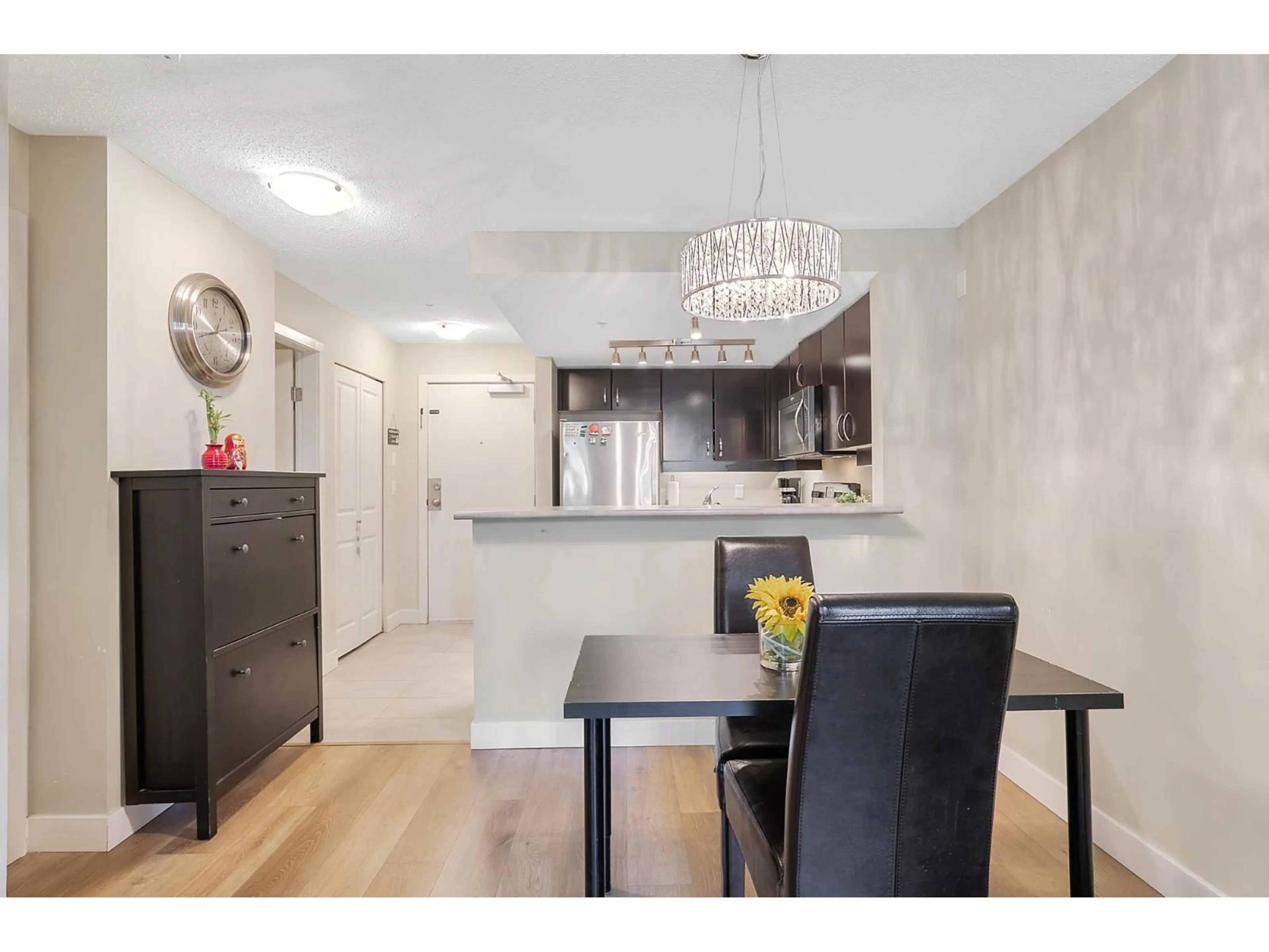 Open concept kitchen, wood/laminate floor for 334 - 10838 CITY PARKWAY, Surrey British Columbia V3T5X9