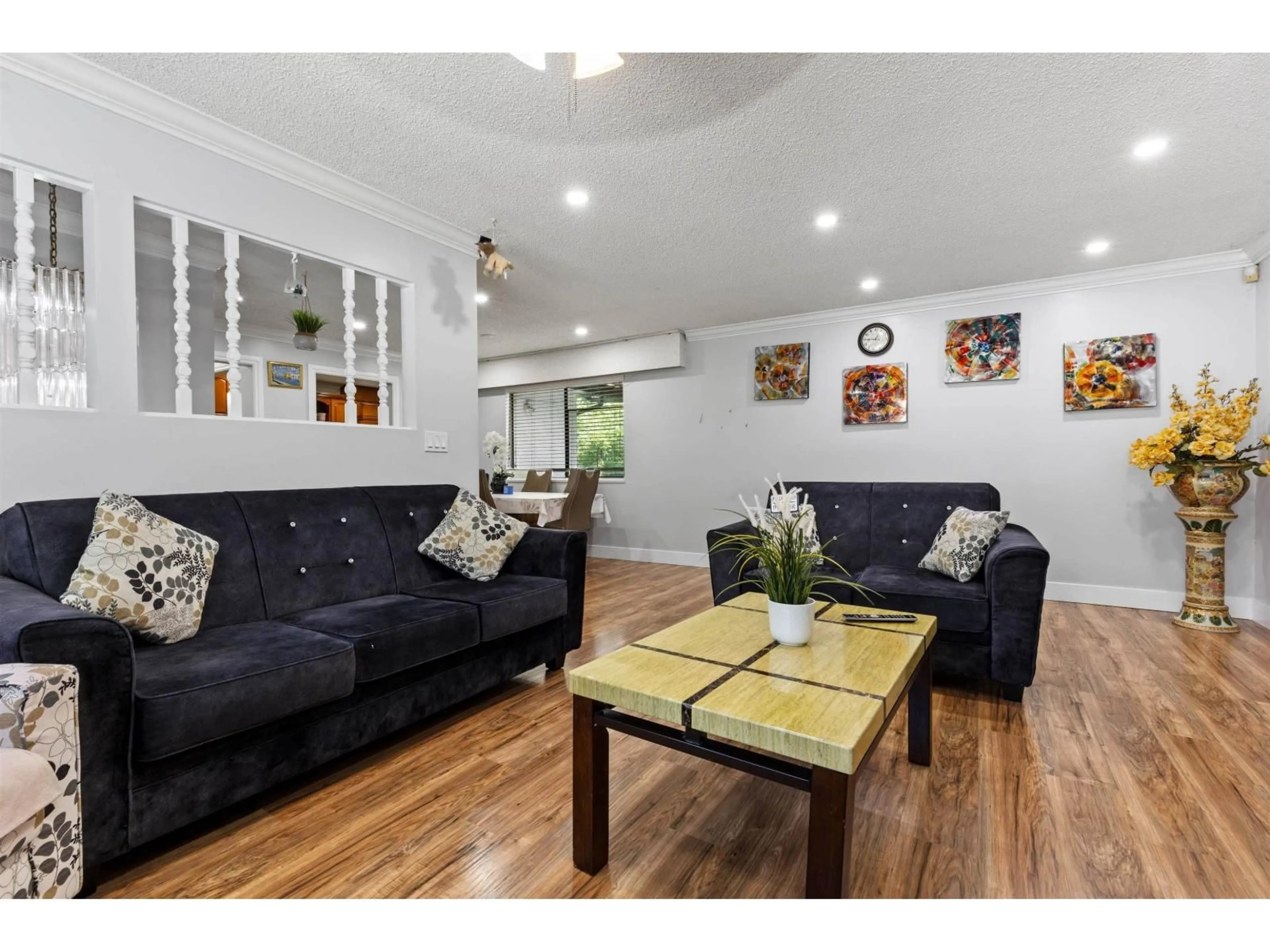 Living room with furniture, wood/laminate floor for 8864 URSUS CRESCENT, Surrey British Columbia V3V6L4