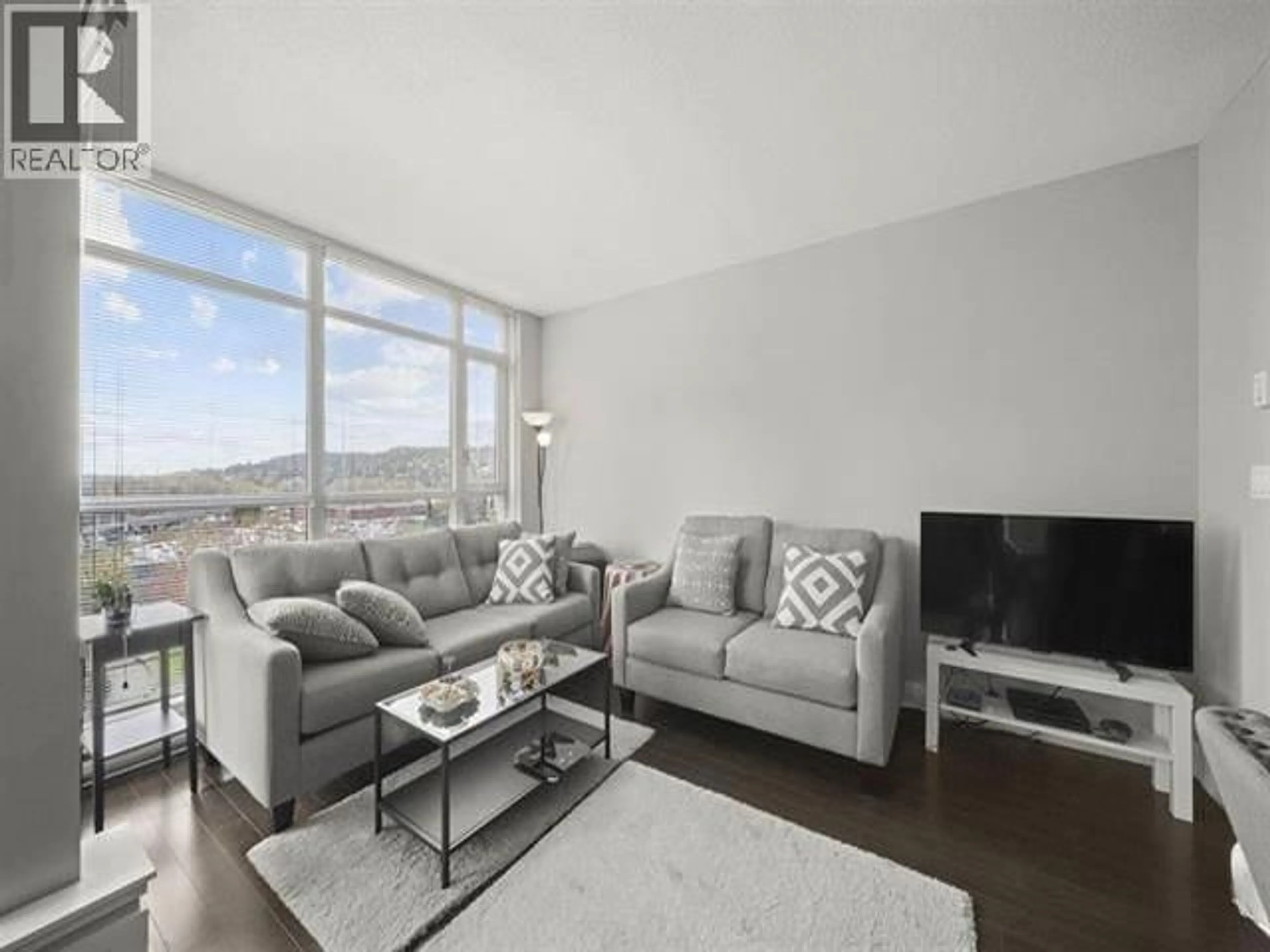Living room with furniture, unknown for 607 - 3008 GLEN DRIVE, Coquitlam British Columbia V3B0J5