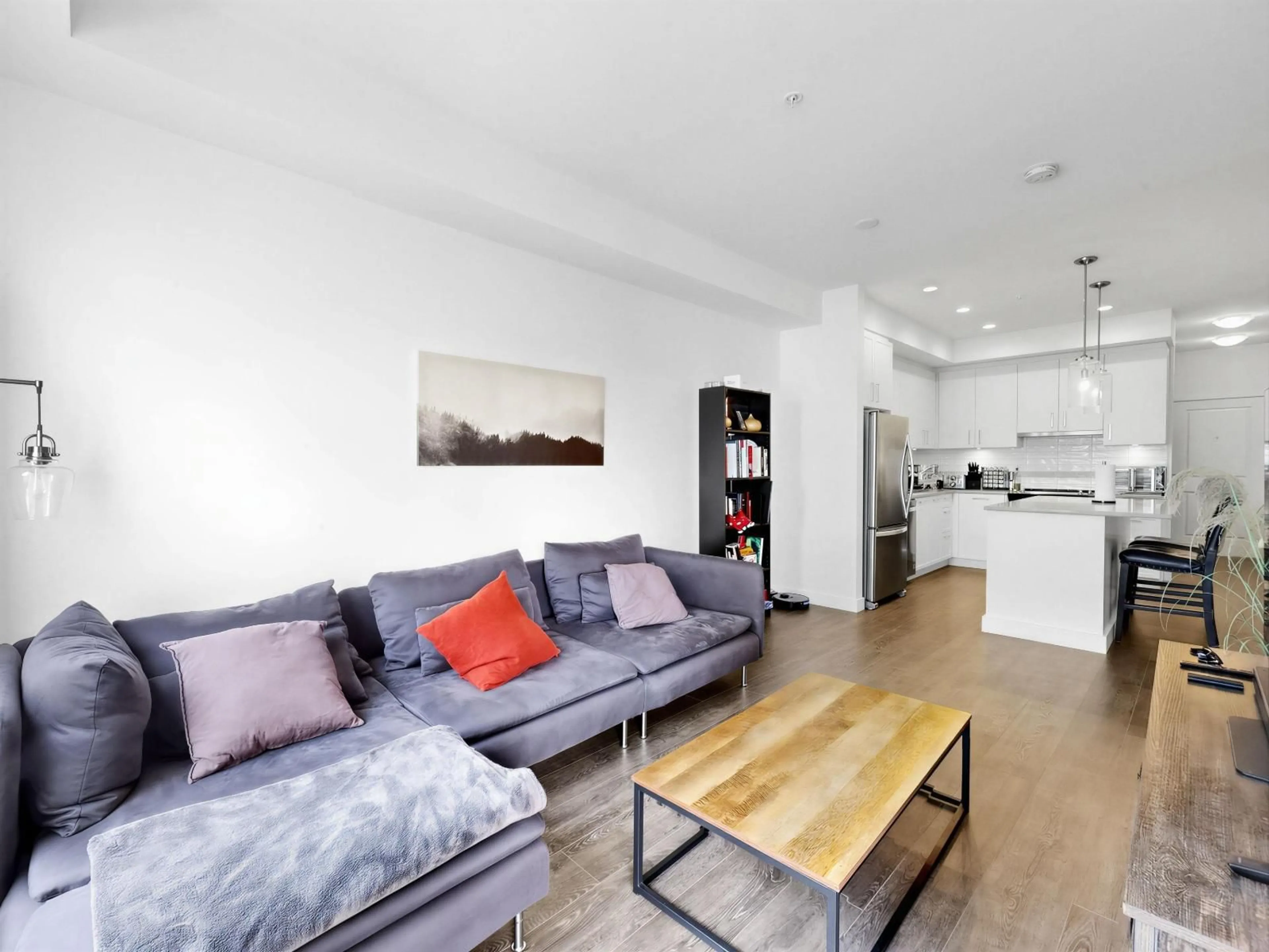 Living room with furniture, wood/laminate floor for A319 - 20834 80 AVENUE, Langley British Columbia V2Y3M4