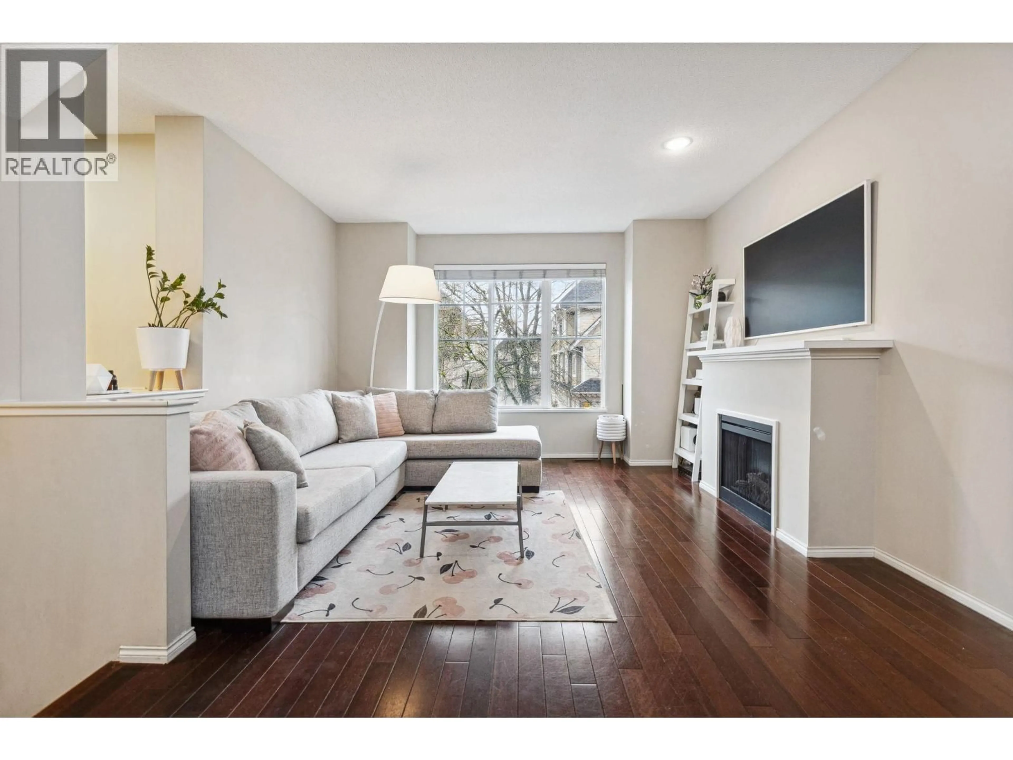 Living room with furniture, wood/laminate floor for 45 - 7233 HEATHER STREET, Richmond British Columbia V6Y4J8