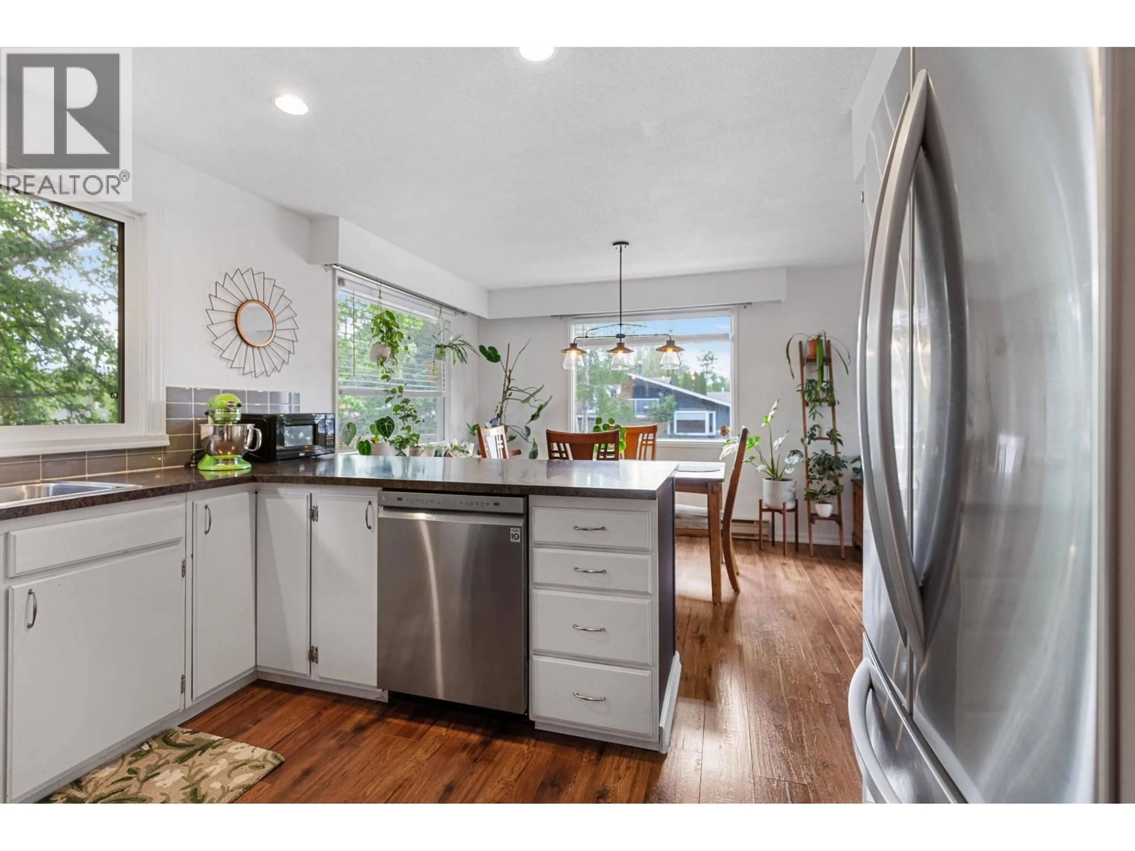 Open concept kitchen, wood/laminate floor for 5305 DALHOUSIE DRIVE, Prince George British Columbia V2N2A1