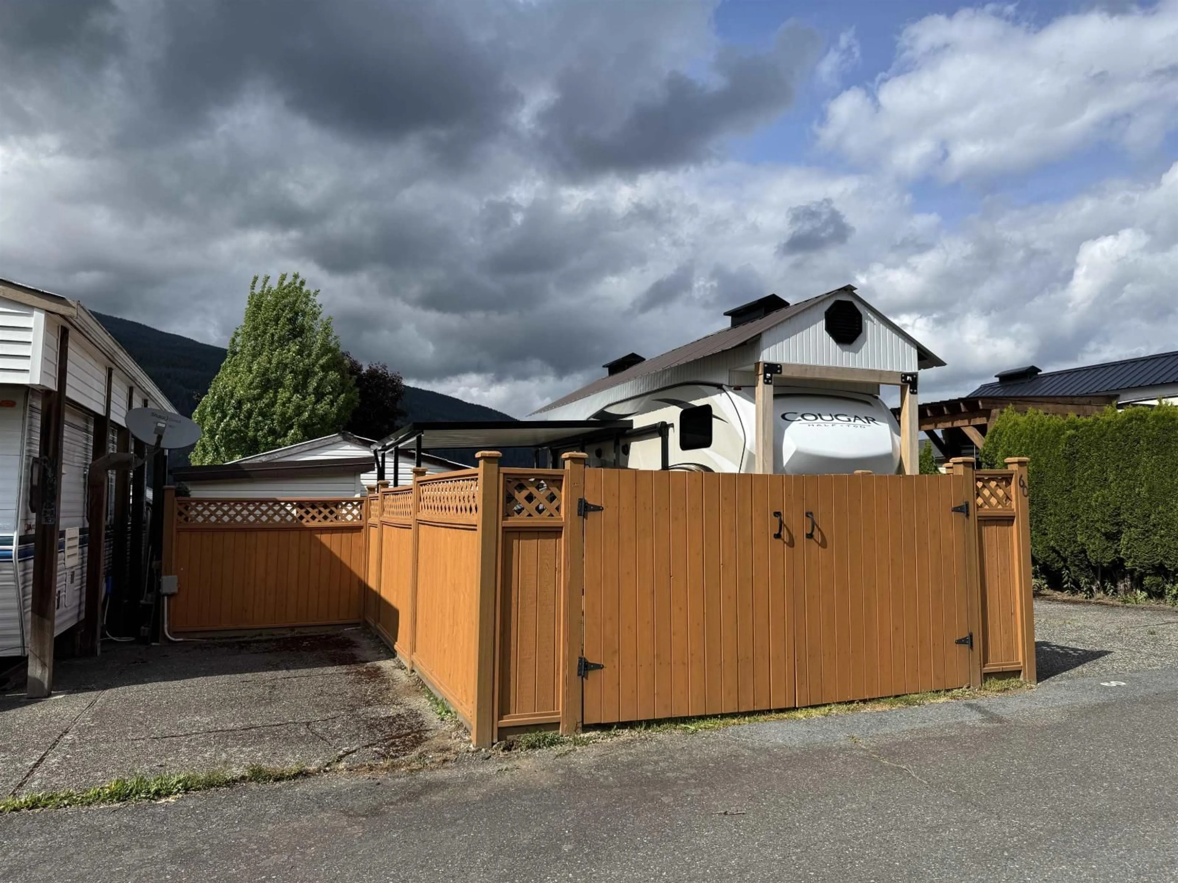 A pic from outside/outdoor area/front of a property/back of a property/a pic from drone, street for 60 - 1436 FROST ROAD, Cultus Lake British Columbia V2R4X8
