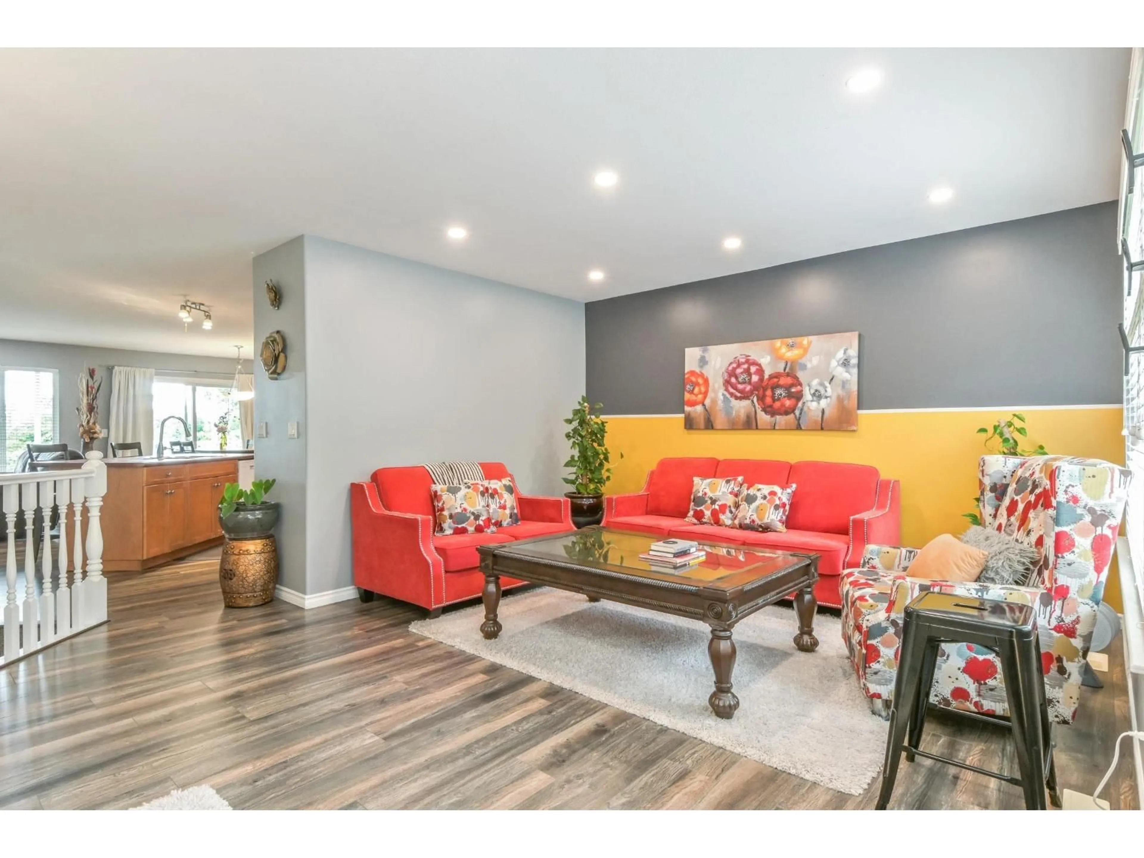 Living room with furniture, wood/laminate floor for 35109 LABURNUM AVENUE, Abbotsford British Columbia V2S8K3