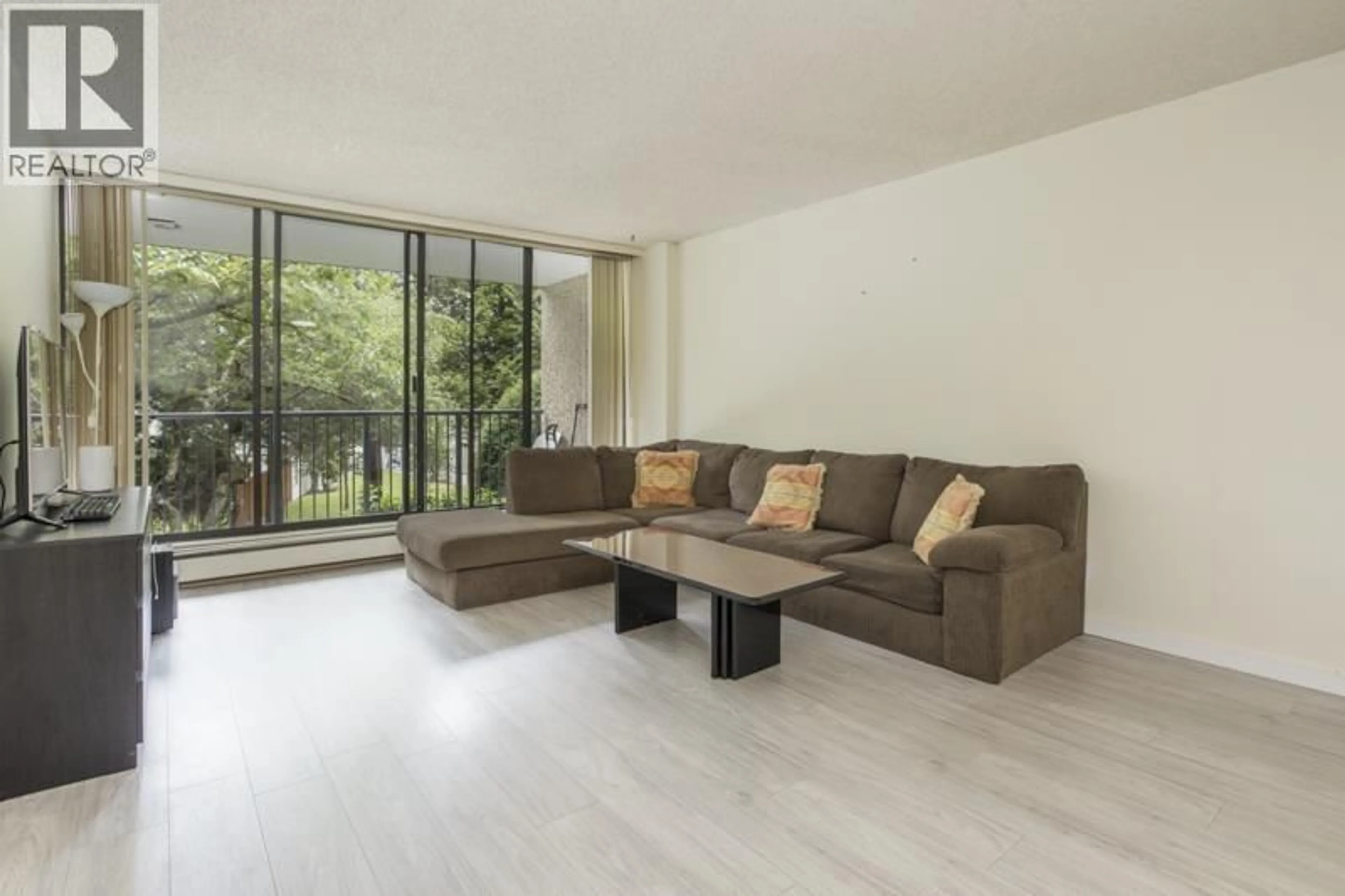 Living room with furniture, wood/laminate floor for 209 - 9300 PARKSVILLE DRIVE, Richmond British Columbia V7E4W3
