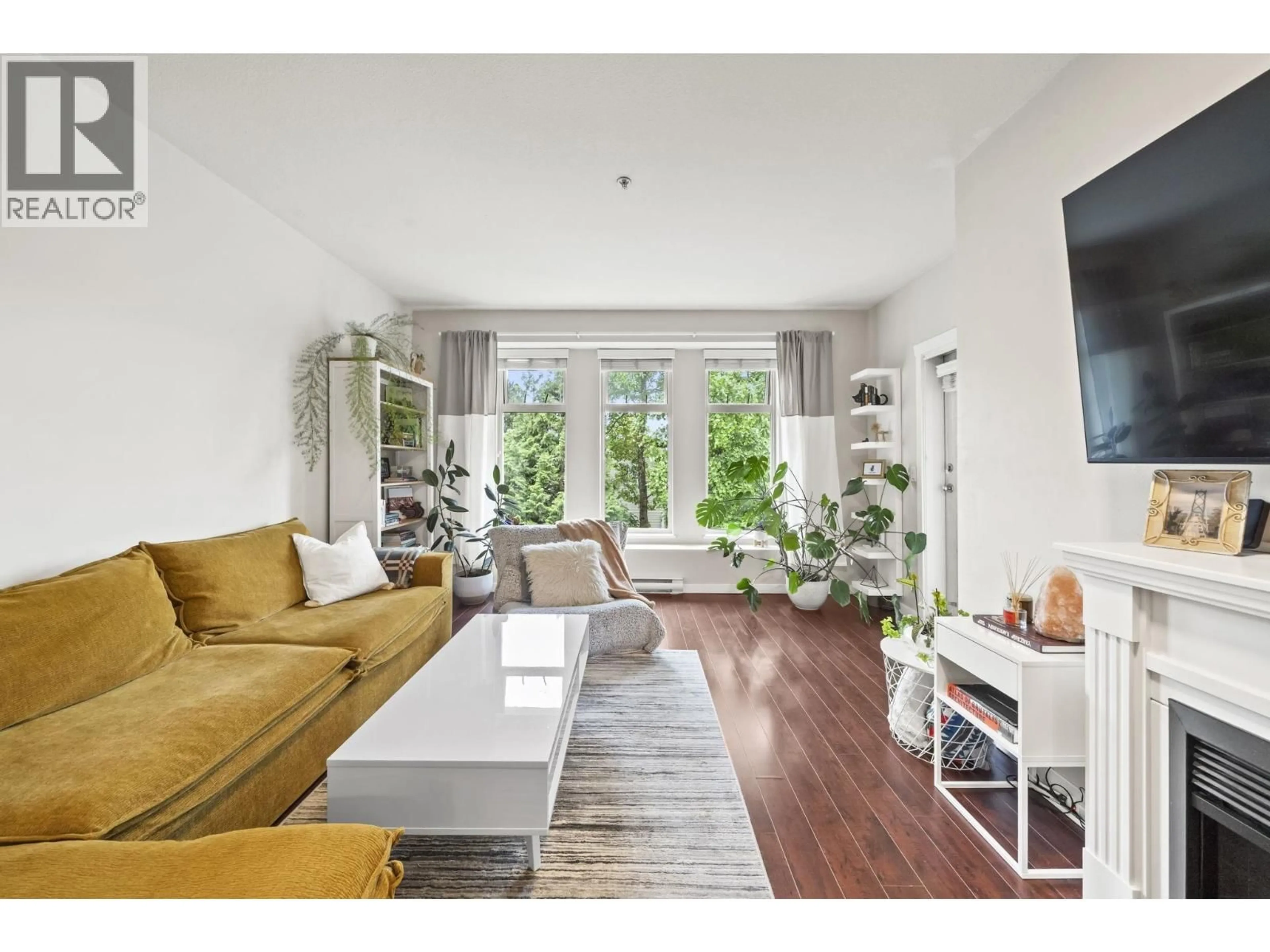 Living room with furniture, wood/laminate floor for 302 - 2488 WELCHER AVENUE, Port Coquitlam British Columbia V3C1X7