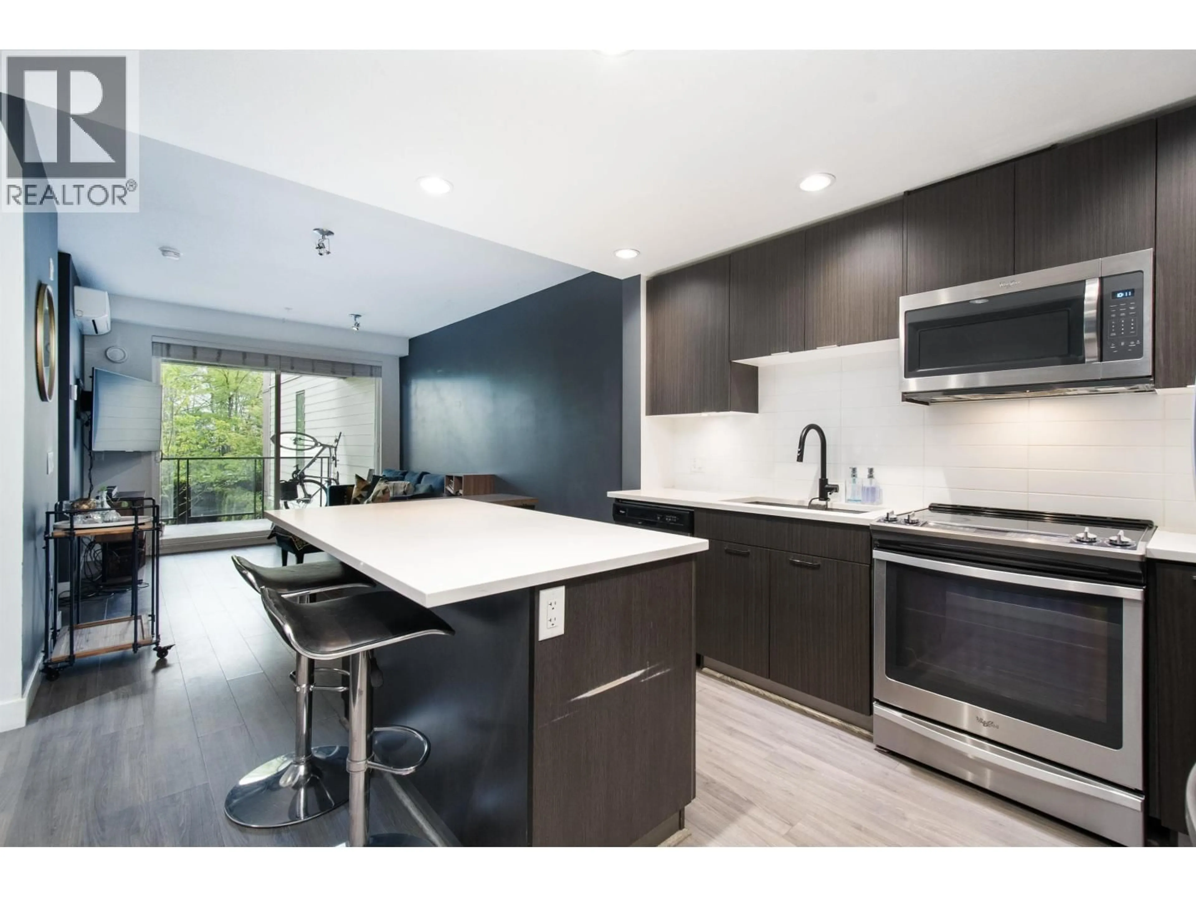 Open concept kitchen, ceramic/tile floor for 201 - 719 3RD STREET, North Vancouver British Columbia V7M0E7