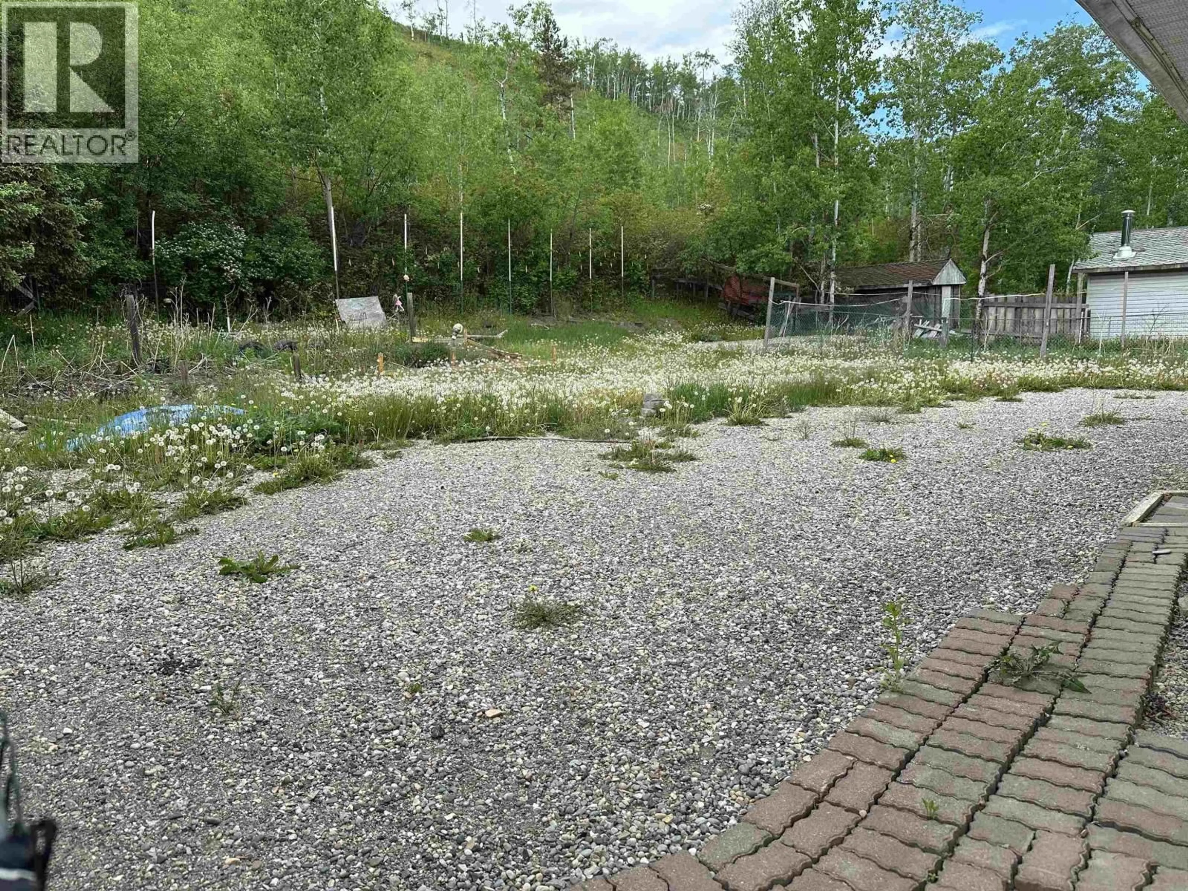 A pic from outside/outdoor area/front of a property/back of a property/a pic from drone, forest/trees view for 10113 BEATTIE DRIVE, Hudsons Hope British Columbia V0C1V0