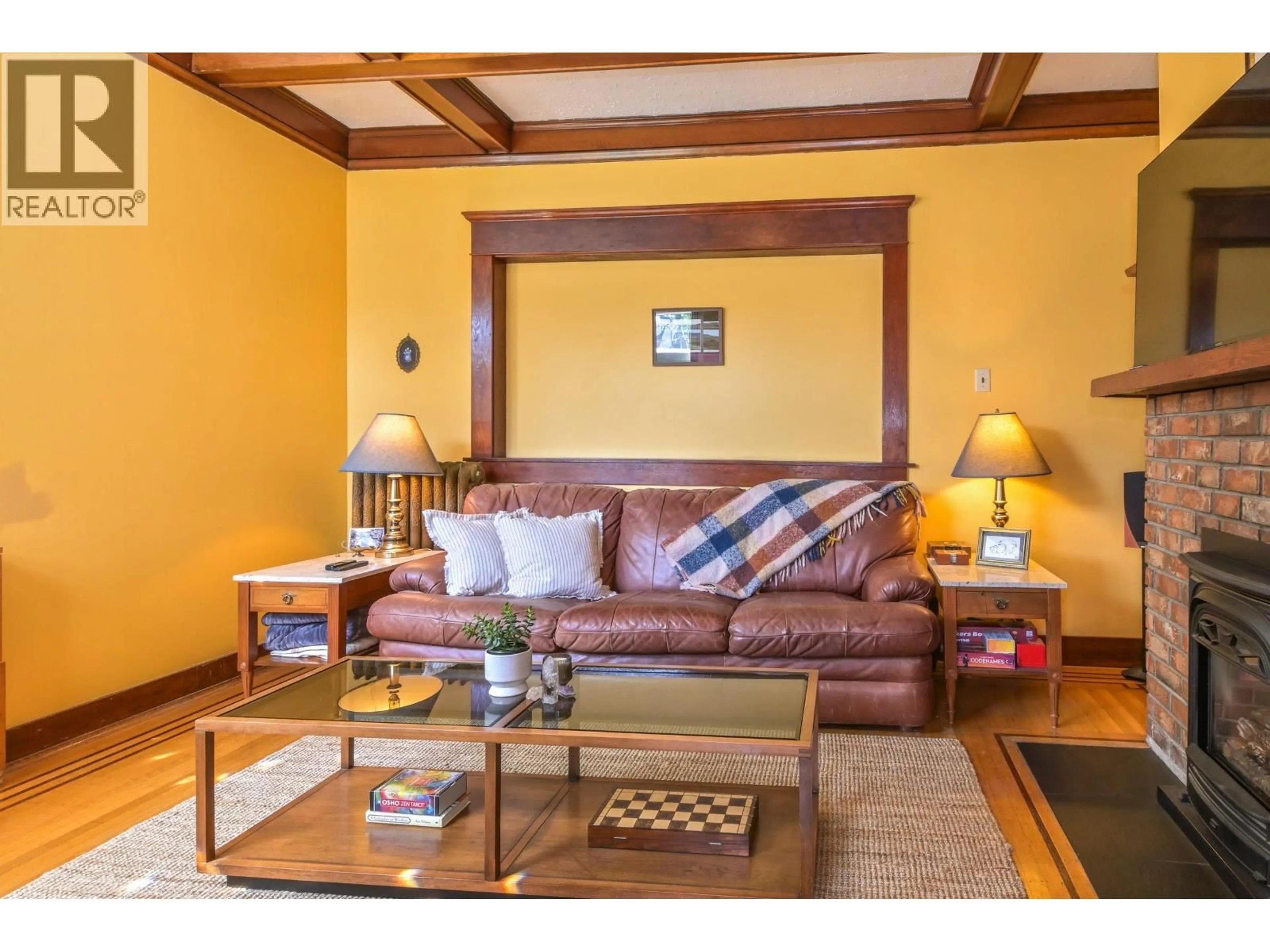Living room with furniture, wood/laminate floor for 3422 - - 3424 2ND AVENUE, Vancouver British Columbia V6R1J2