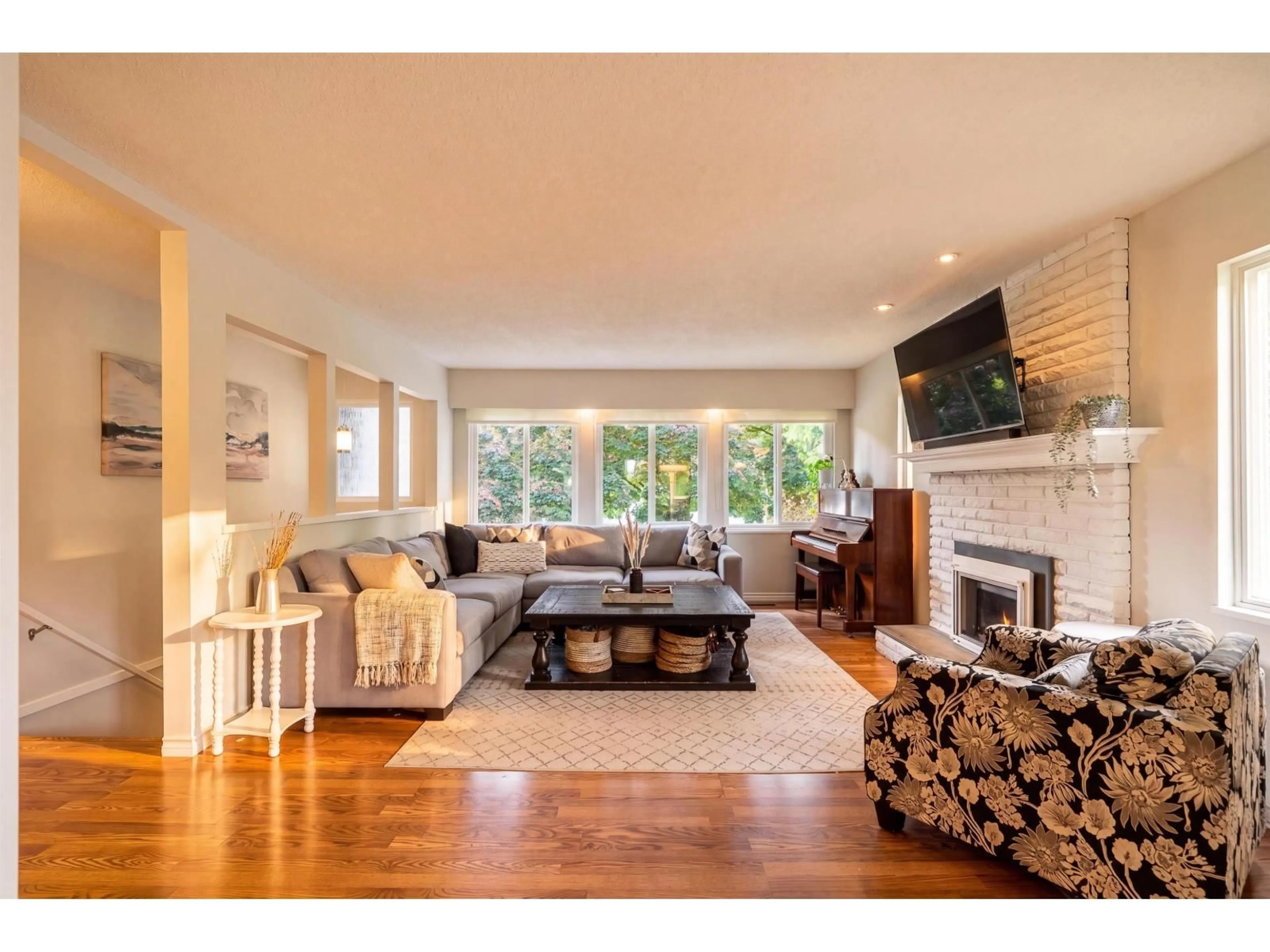Living room with furniture, wood/laminate floor for 4542 206A STREET, Langley British Columbia V3A6L1