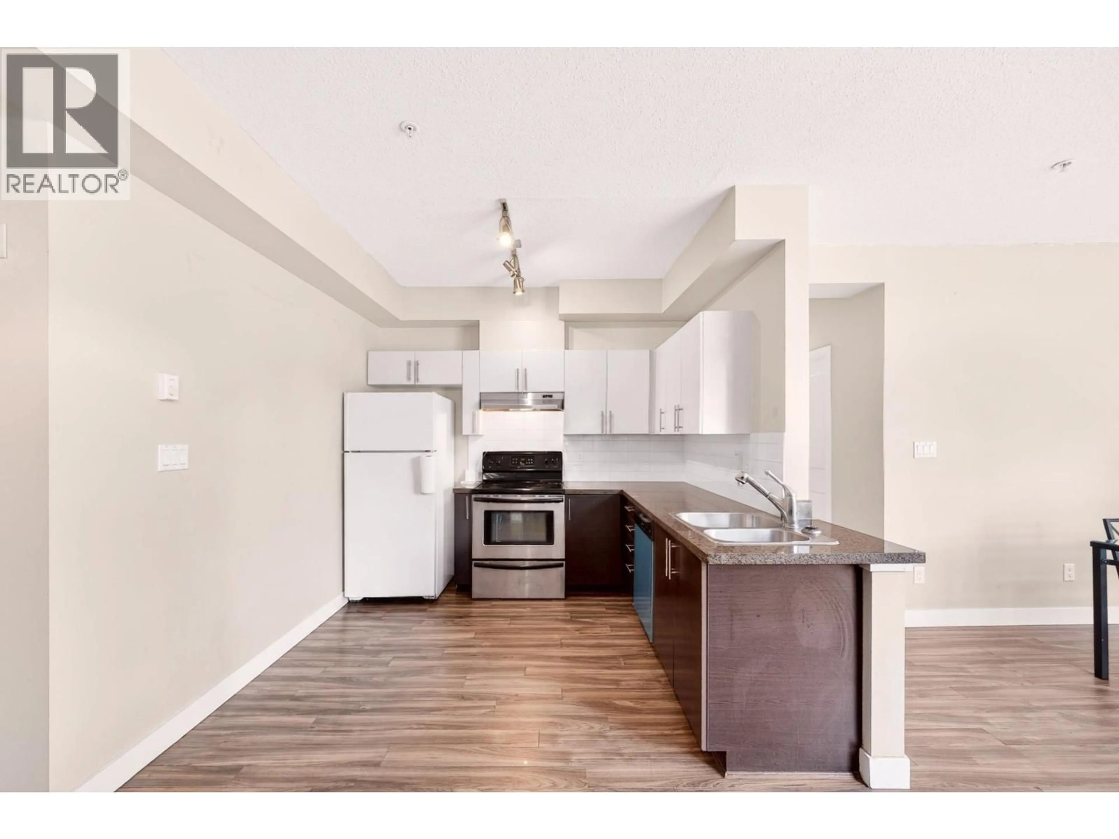 Open concept kitchen, wood/laminate floor for 109 - 5692 KINGS ROAD, Vancouver British Columbia V6T1K8