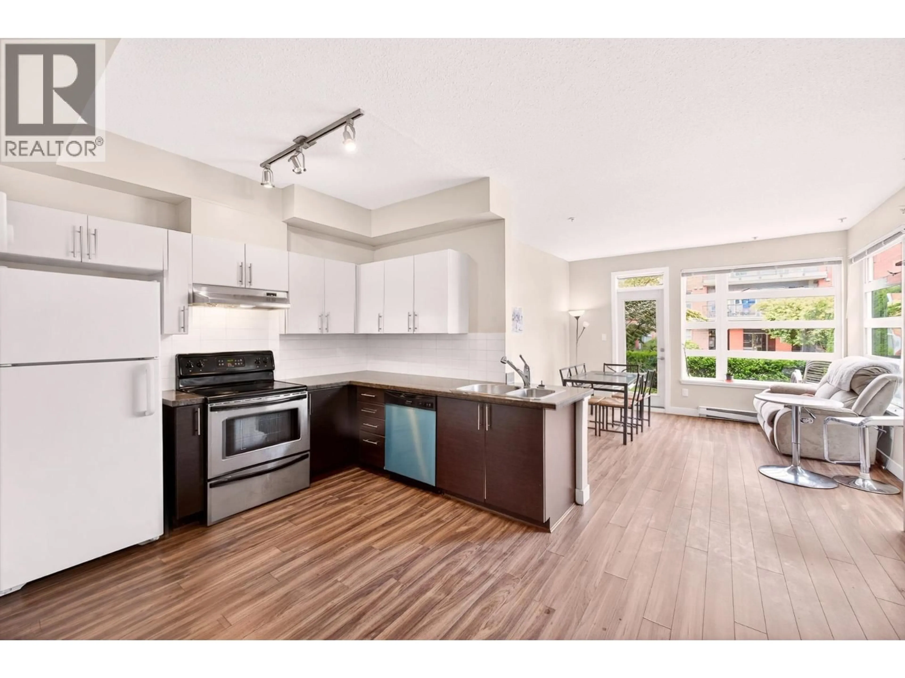Open concept kitchen, wood/laminate floor for 109 - 5692 KINGS ROAD, Vancouver British Columbia V6T1K8