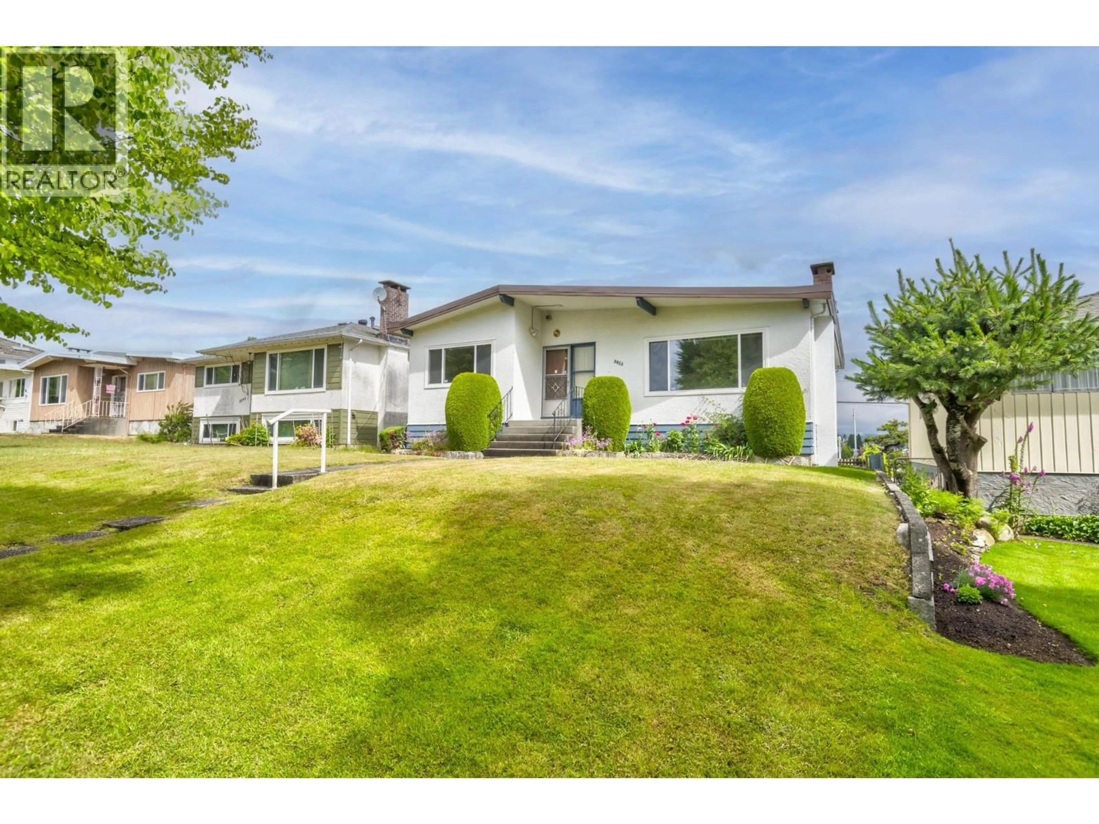 A pic from outside/outdoor area/front of a property/back of a property/a pic from drone, street for 3053 16TH AVENUE, Vancouver British Columbia V5M2M4