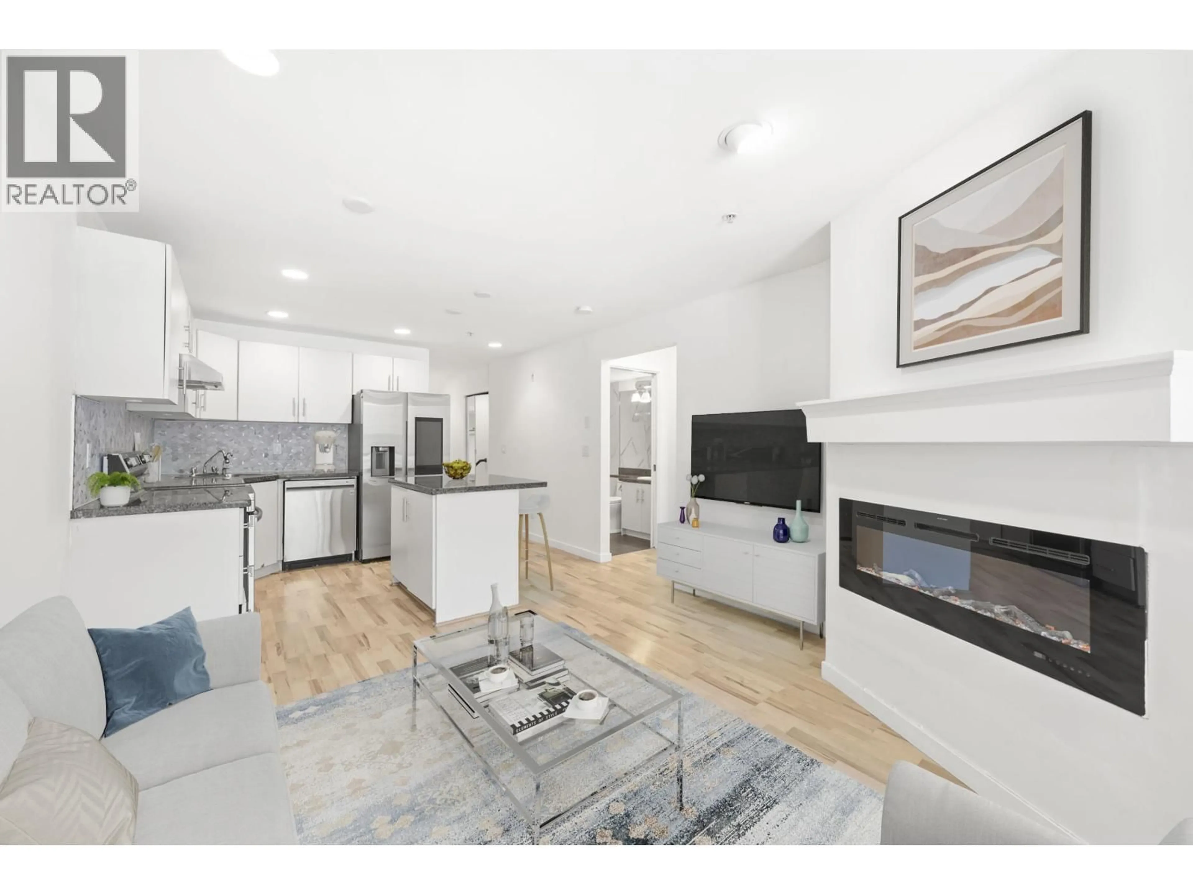 Open concept kitchen, wood/laminate floor for 105 - 5025 JOYCE STREET, Vancouver British Columbia V5R4G7