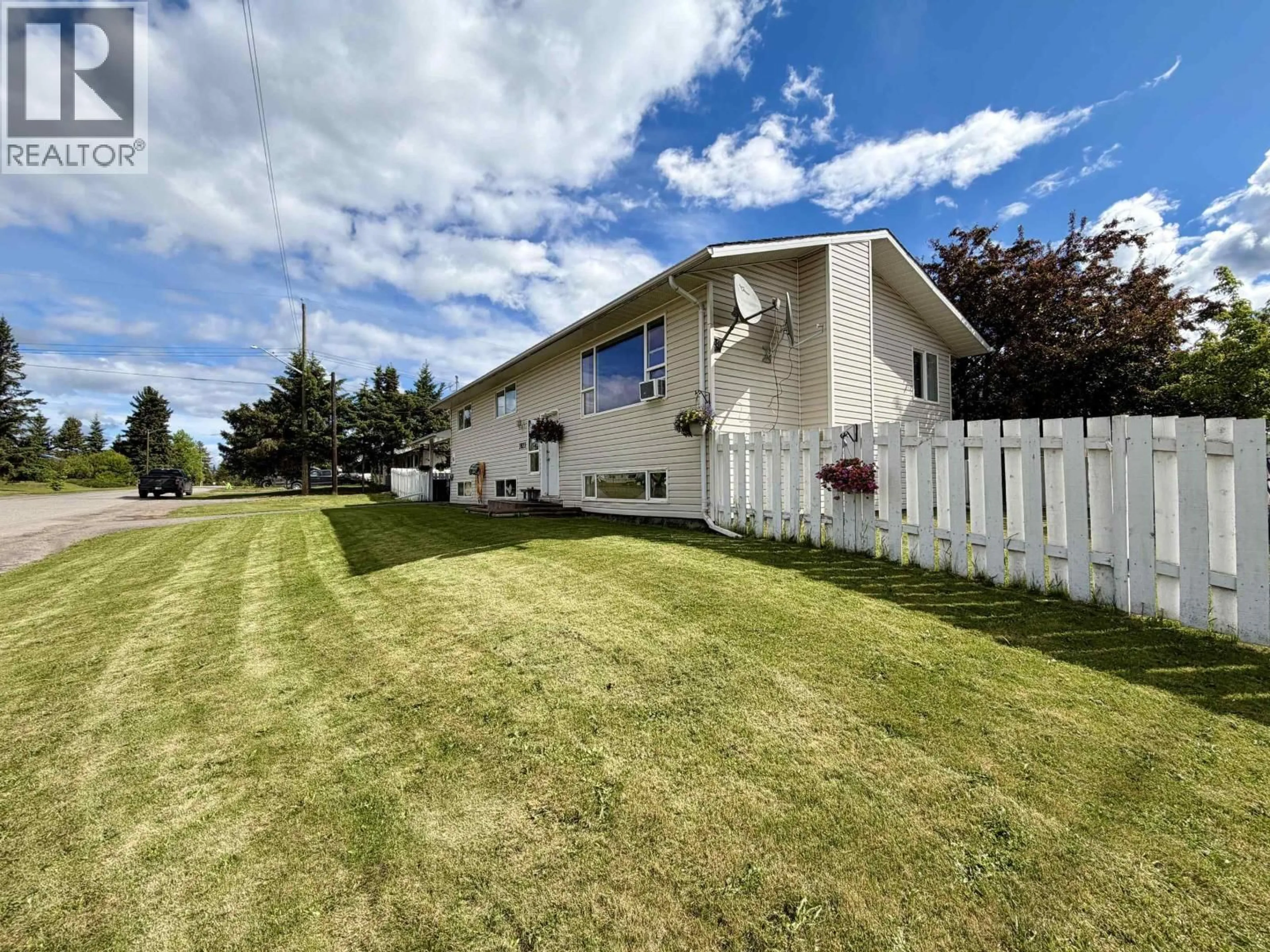 A pic from outside/outdoor area/front of a property/back of a property/a pic from drone, mountain view for 3822 13TH AVENUE, Smithers British Columbia V0J2N0