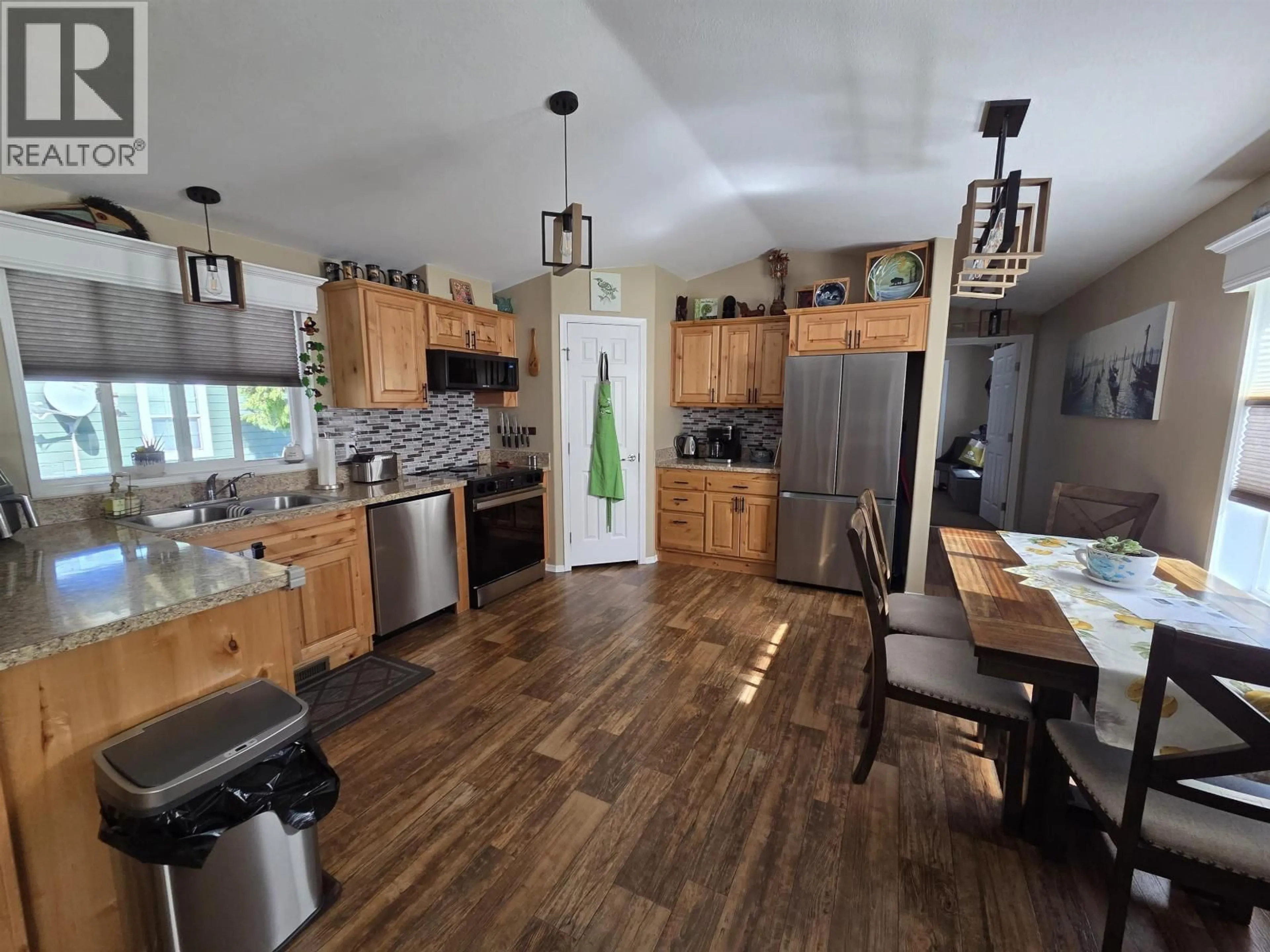 Open concept kitchen, wood/laminate floor for 73 - 3616 LARCH AVENUE, Thornhill British Columbia V8G5B9