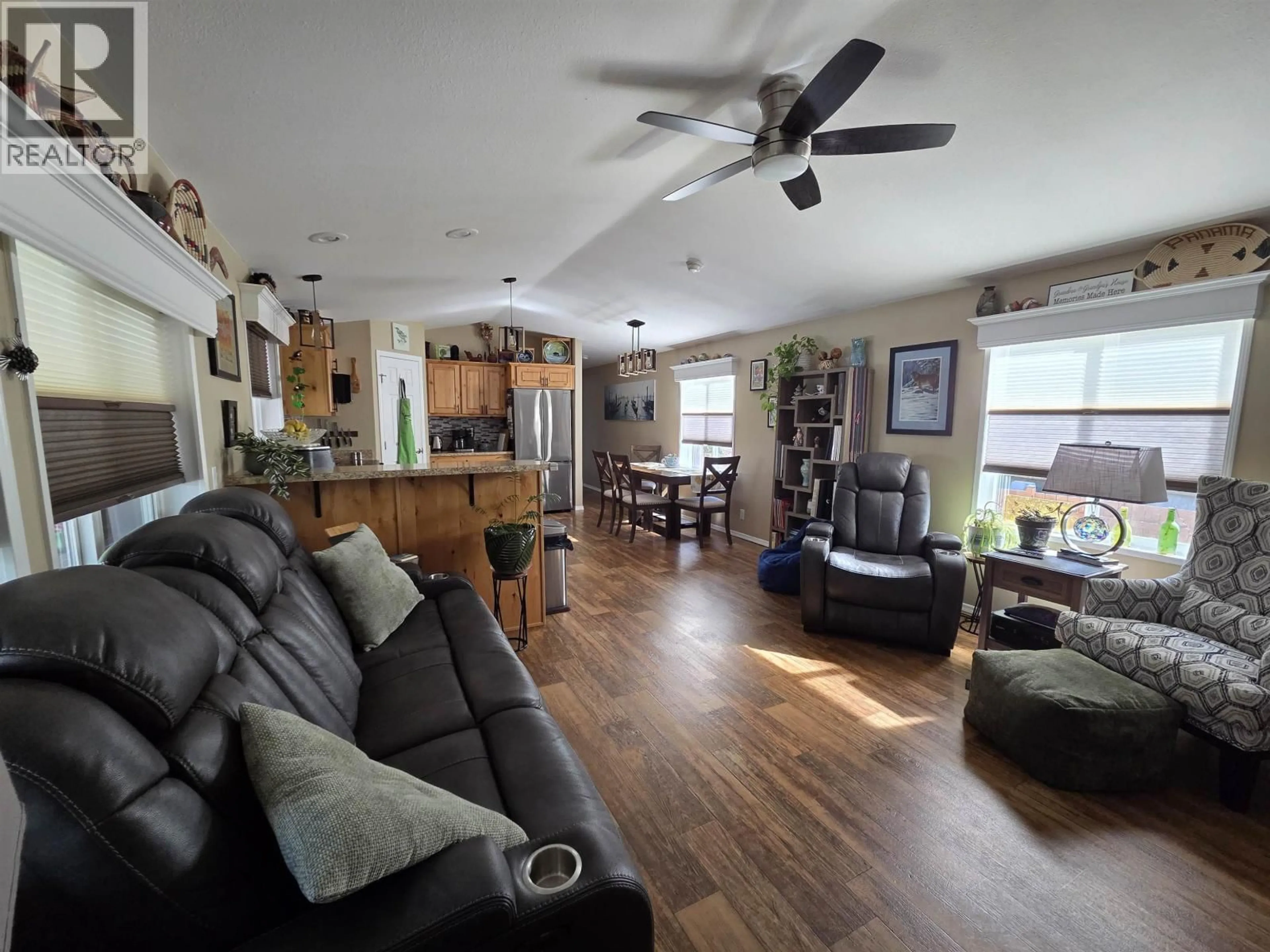 Living room with furniture, wood/laminate floor for 73 - 3616 LARCH AVENUE, Thornhill British Columbia V8G5B9