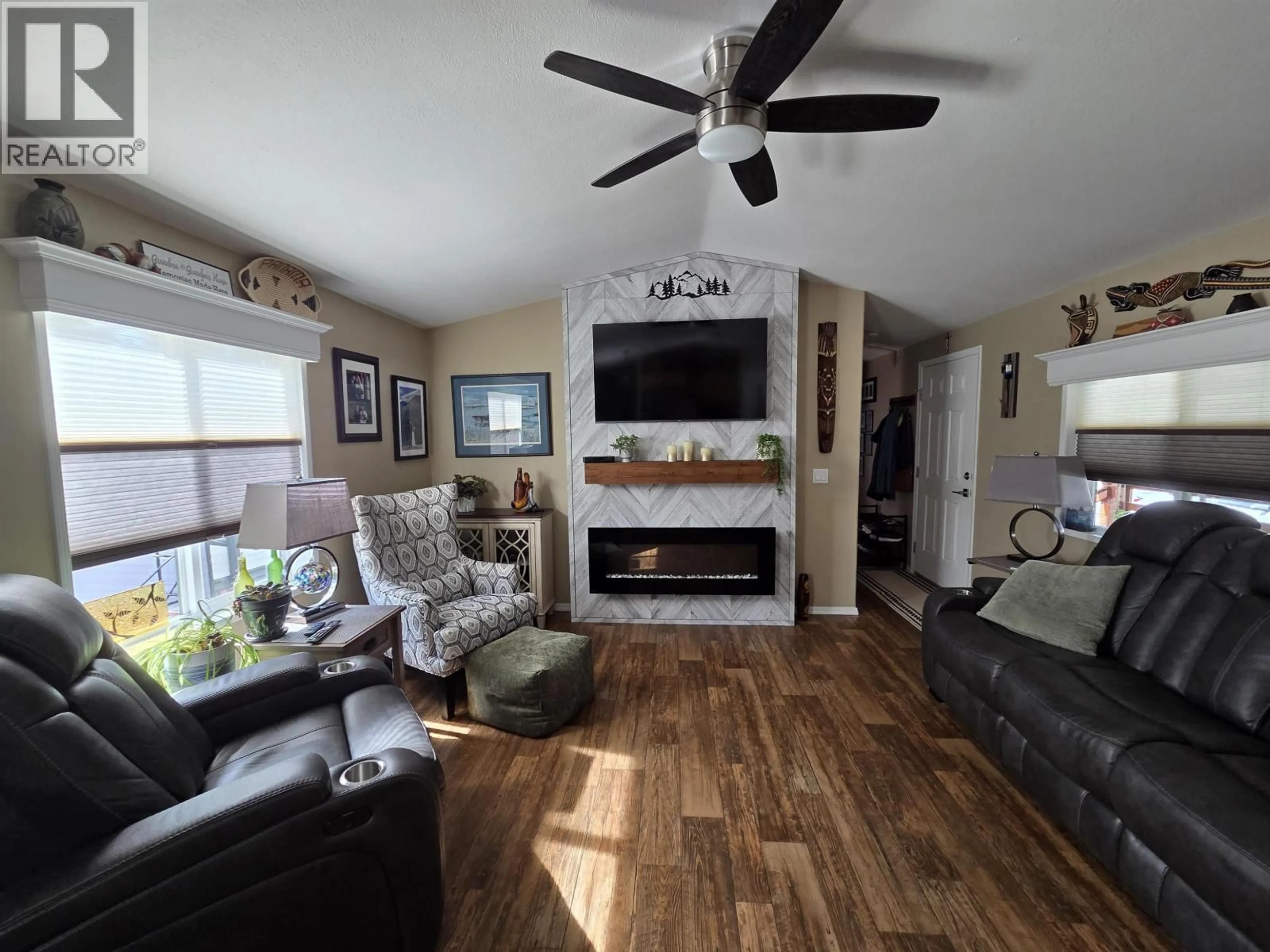 Living room with furniture, wood/laminate floor for 73 - 3616 LARCH AVENUE, Thornhill British Columbia V8G5B9