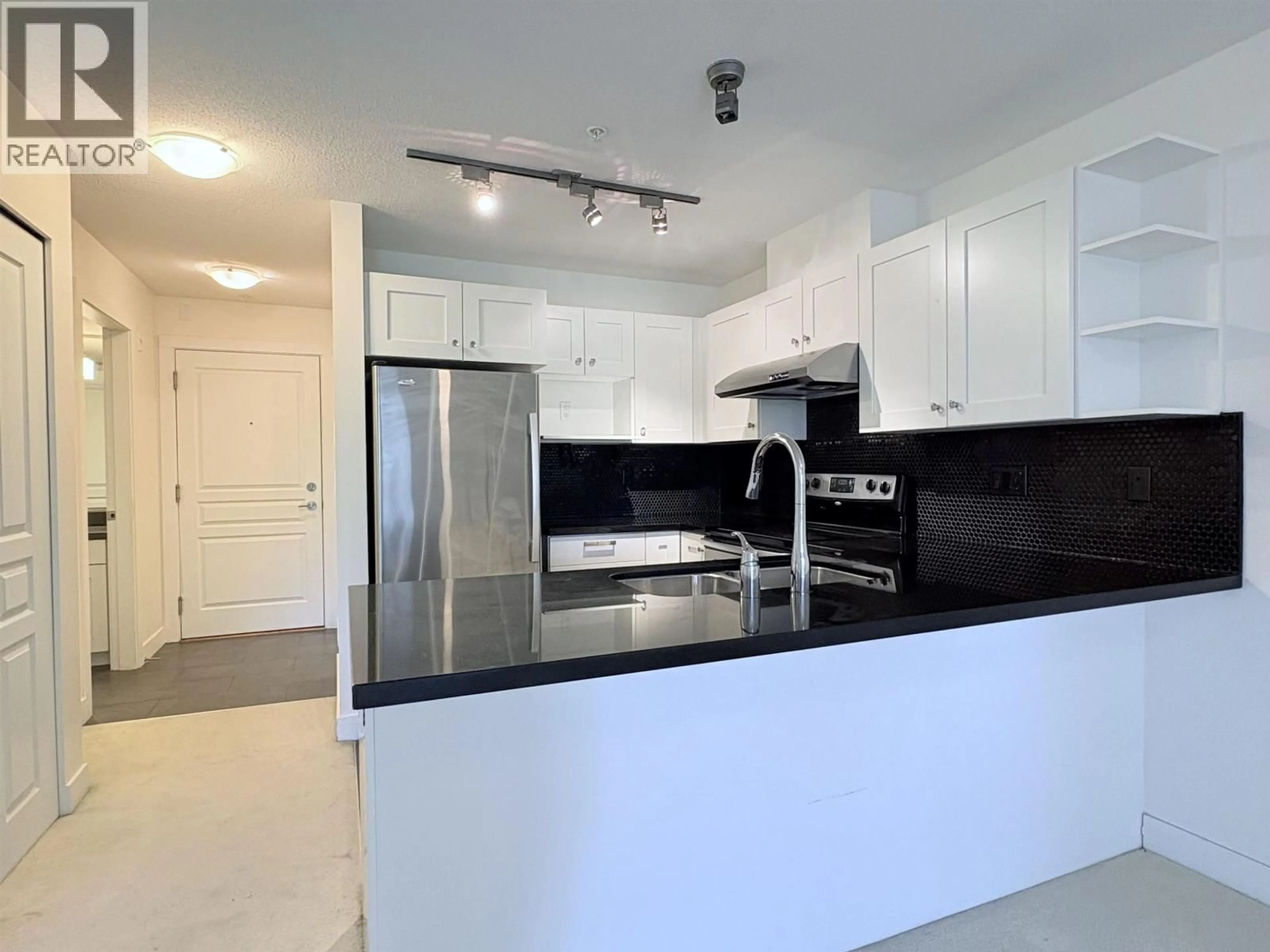 Open concept kitchen, unknown for 305 - 4550 FRASER STREET, Vancouver British Columbia V5V4G8