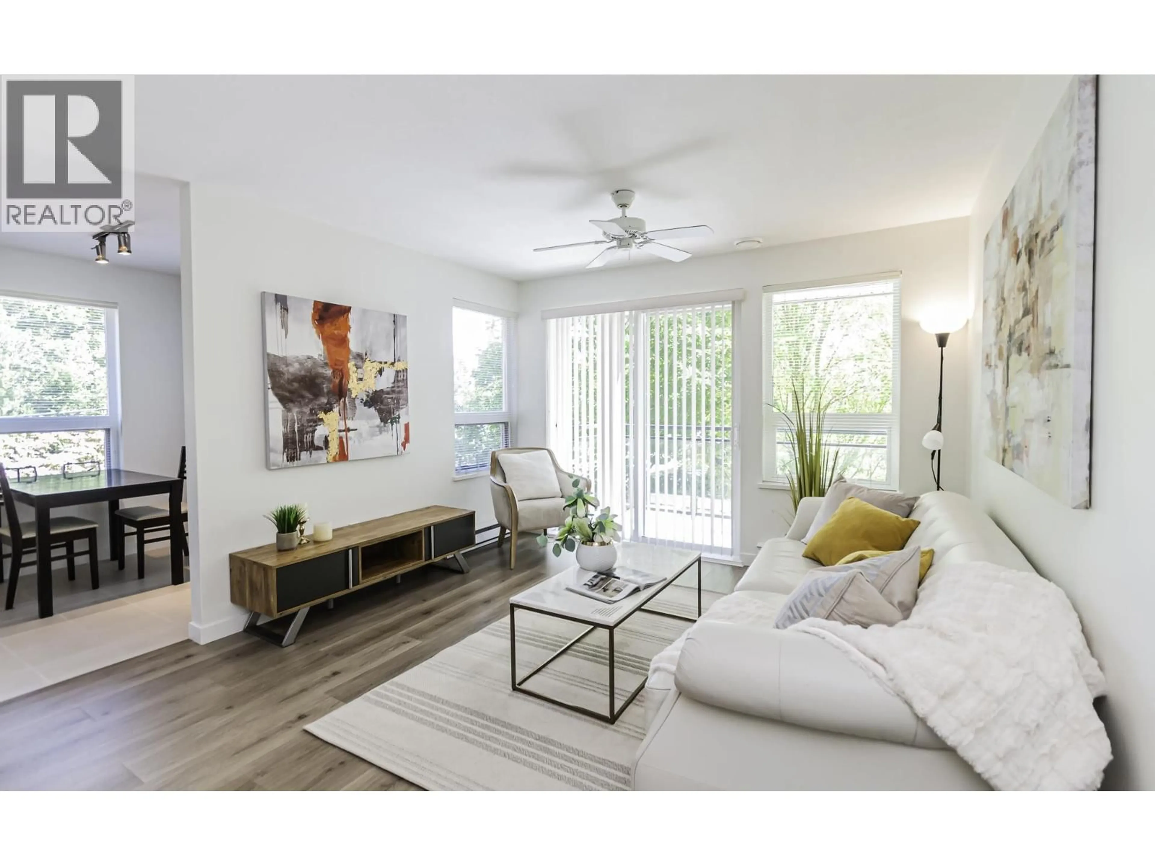 Living room with furniture, wood/laminate floor for 205 - 9500 ODLIN ROAD, Richmond British Columbia V6X0H5