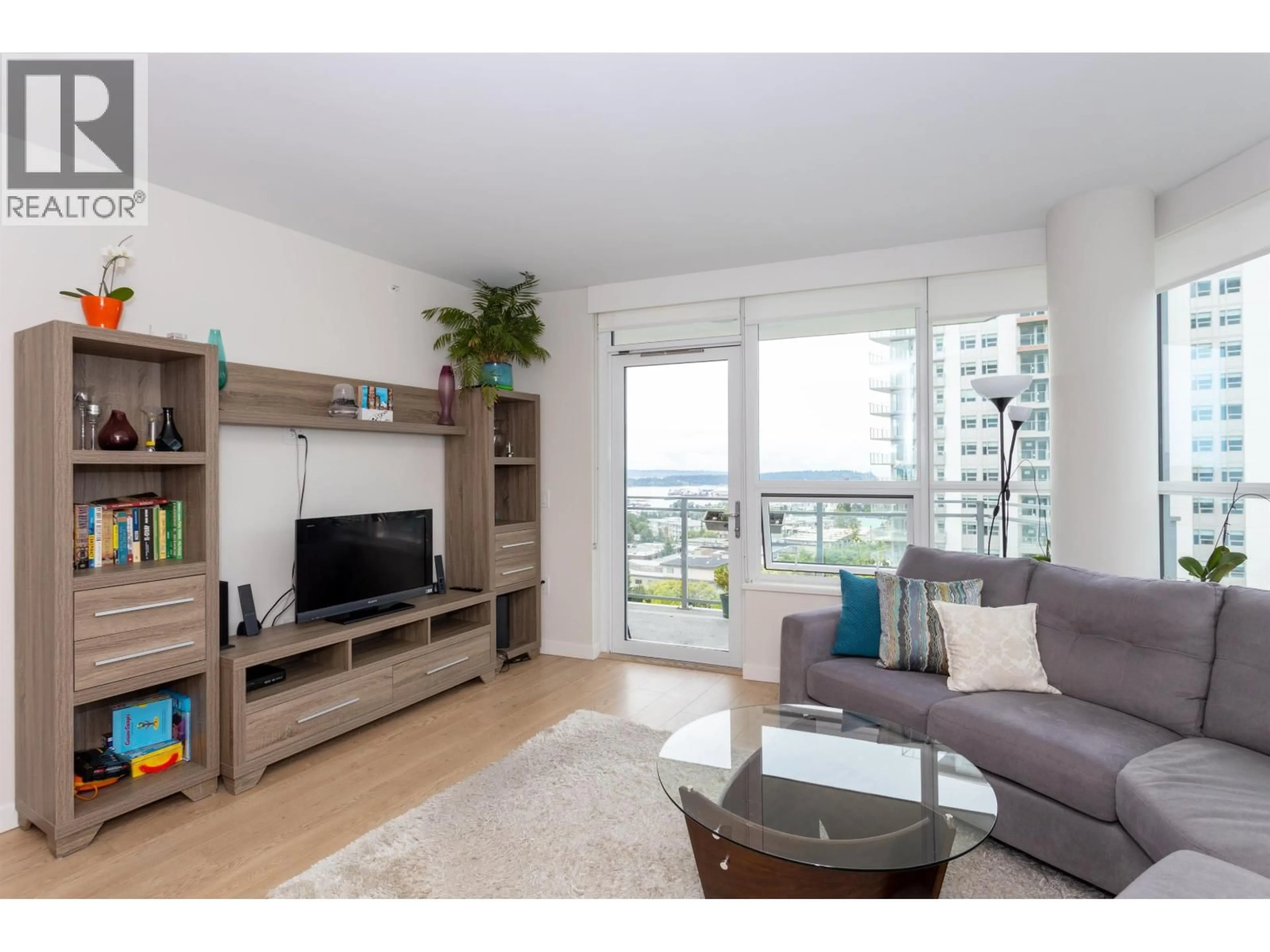 Living room with furniture, wood/laminate floor for 707 - 112 13TH STREET, North Vancouver British Columbia V7L0E4