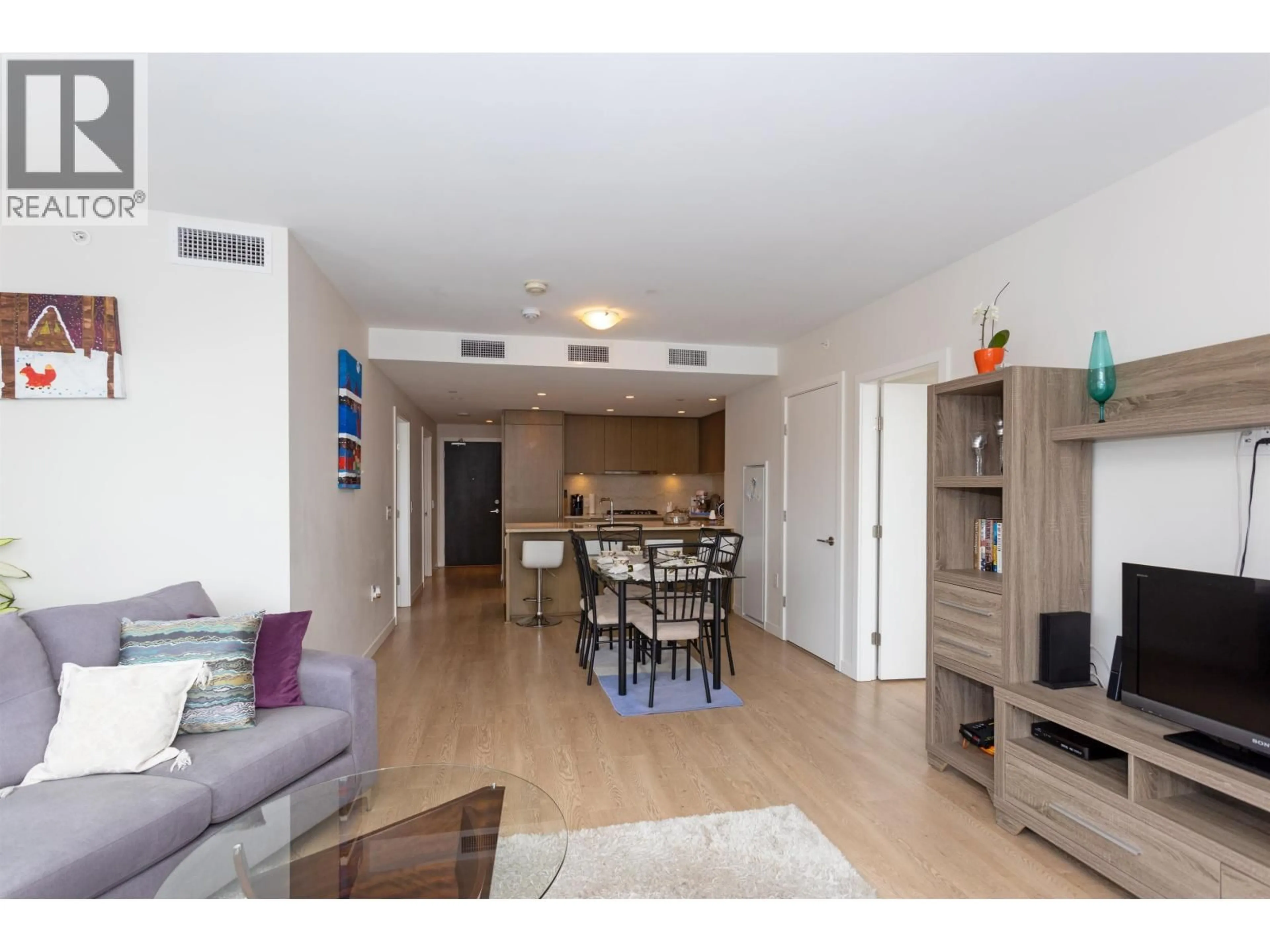 Living room with furniture, wood/laminate floor for 707 - 112 13TH STREET, North Vancouver British Columbia V7L0E4
