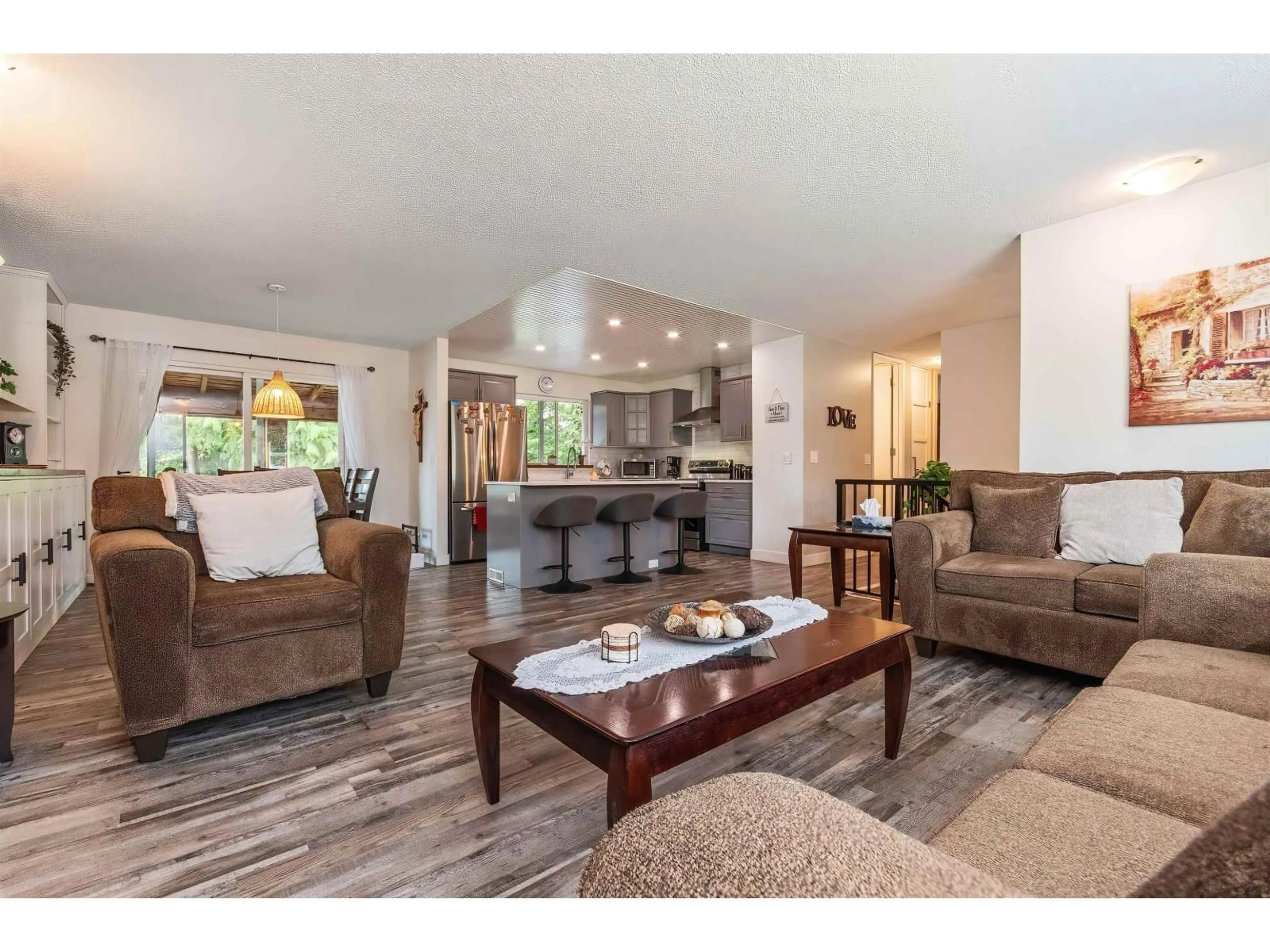 Living room with furniture, wood/laminate floor for 20327 44 AVENUE, Langley British Columbia V3A6P6