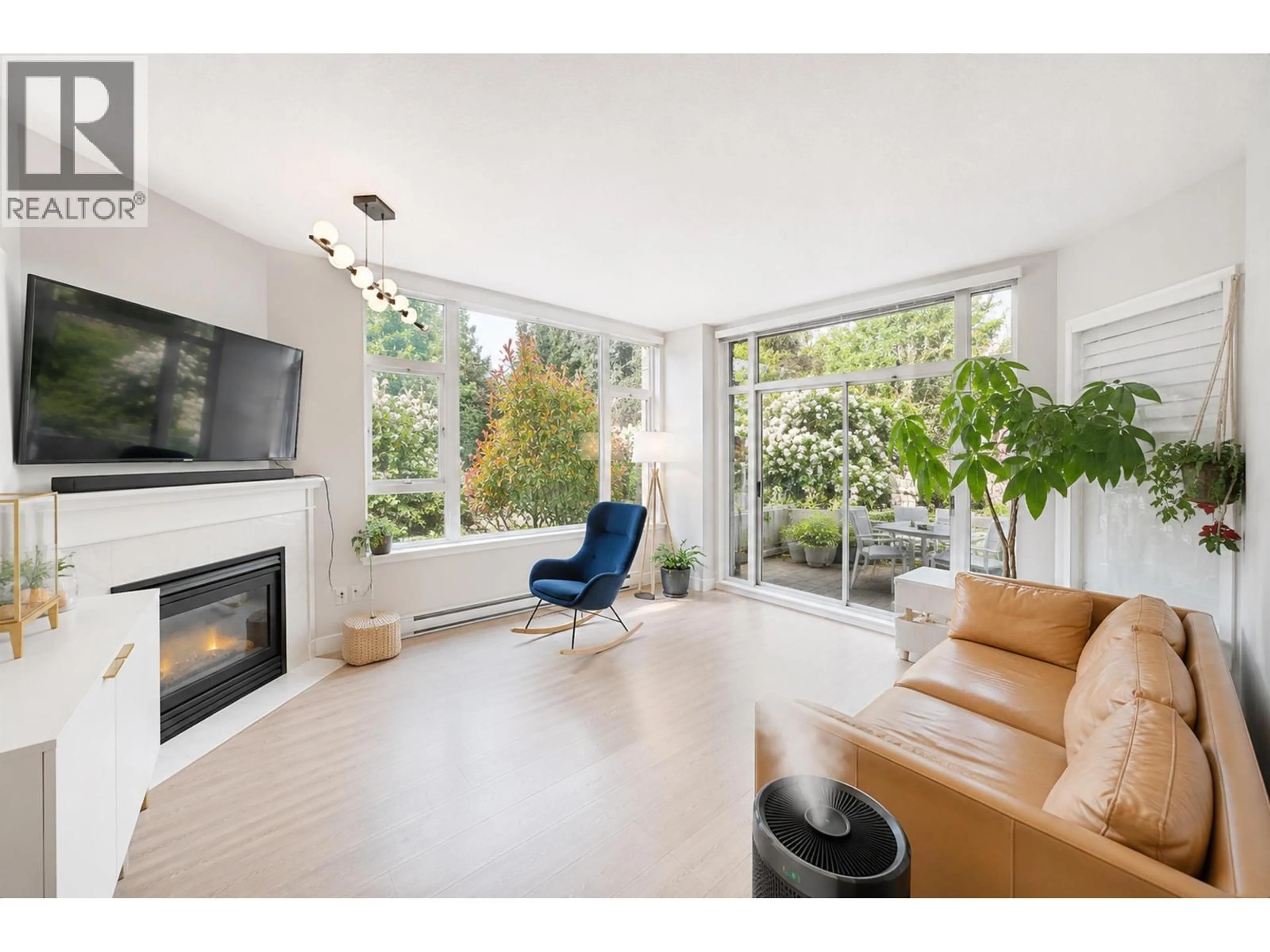 Living room with furniture, unknown for 101 - 7108 EDMONDS STREET, Burnaby British Columbia V3N4X9