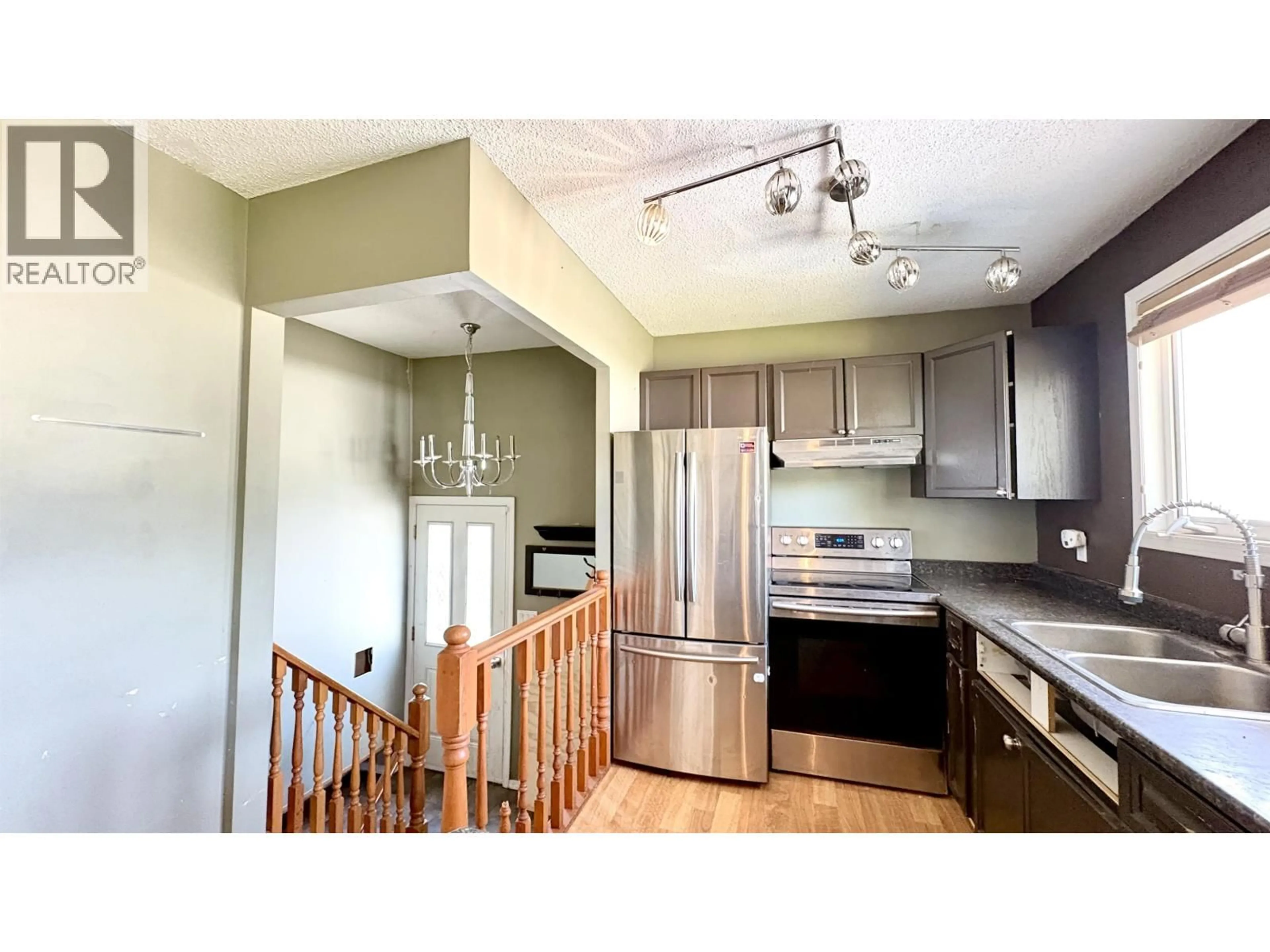 Open concept kitchen, wood/laminate floor for 1298 GENEVIEVE CRESCENT, Prince George British Columbia V2M4K4
