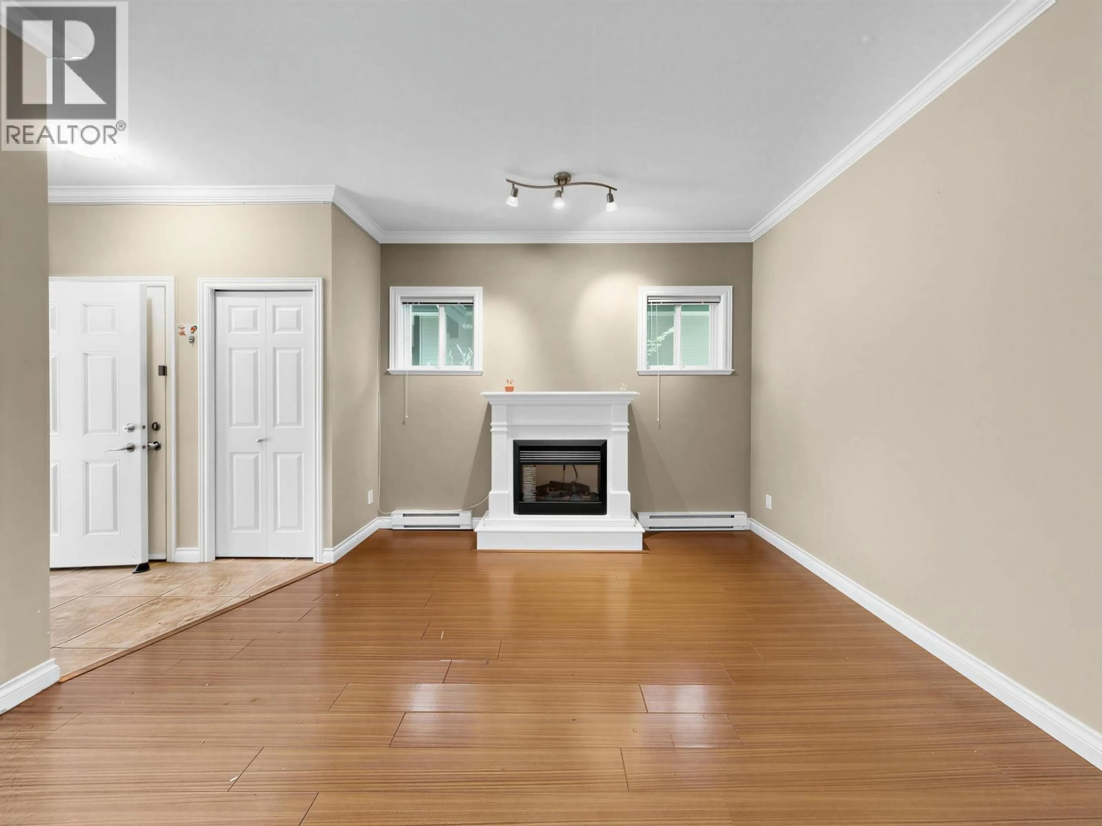 Living room with furniture, wood/laminate floor for 6 - 11511 STEVESTON HIGHWAY, Richmond British Columbia V7A1N8
