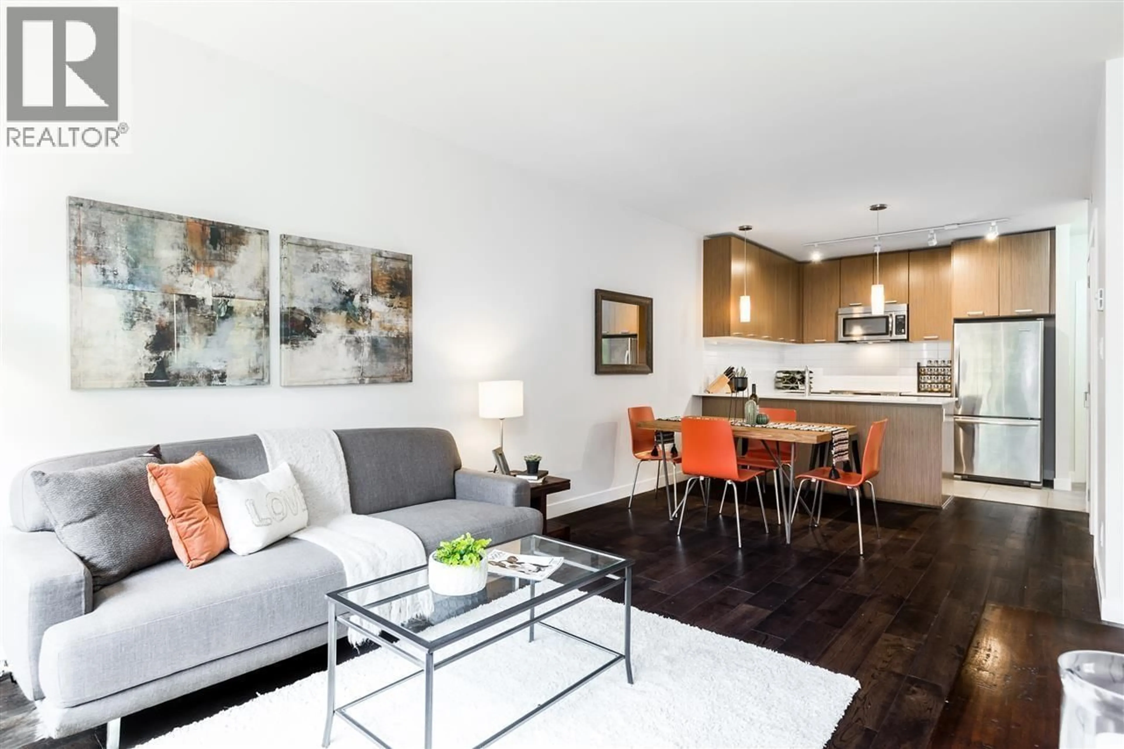 Living room with furniture, wood/laminate floor for 208 - 2321 SCOTIA STREET, Vancouver British Columbia V5T0A8
