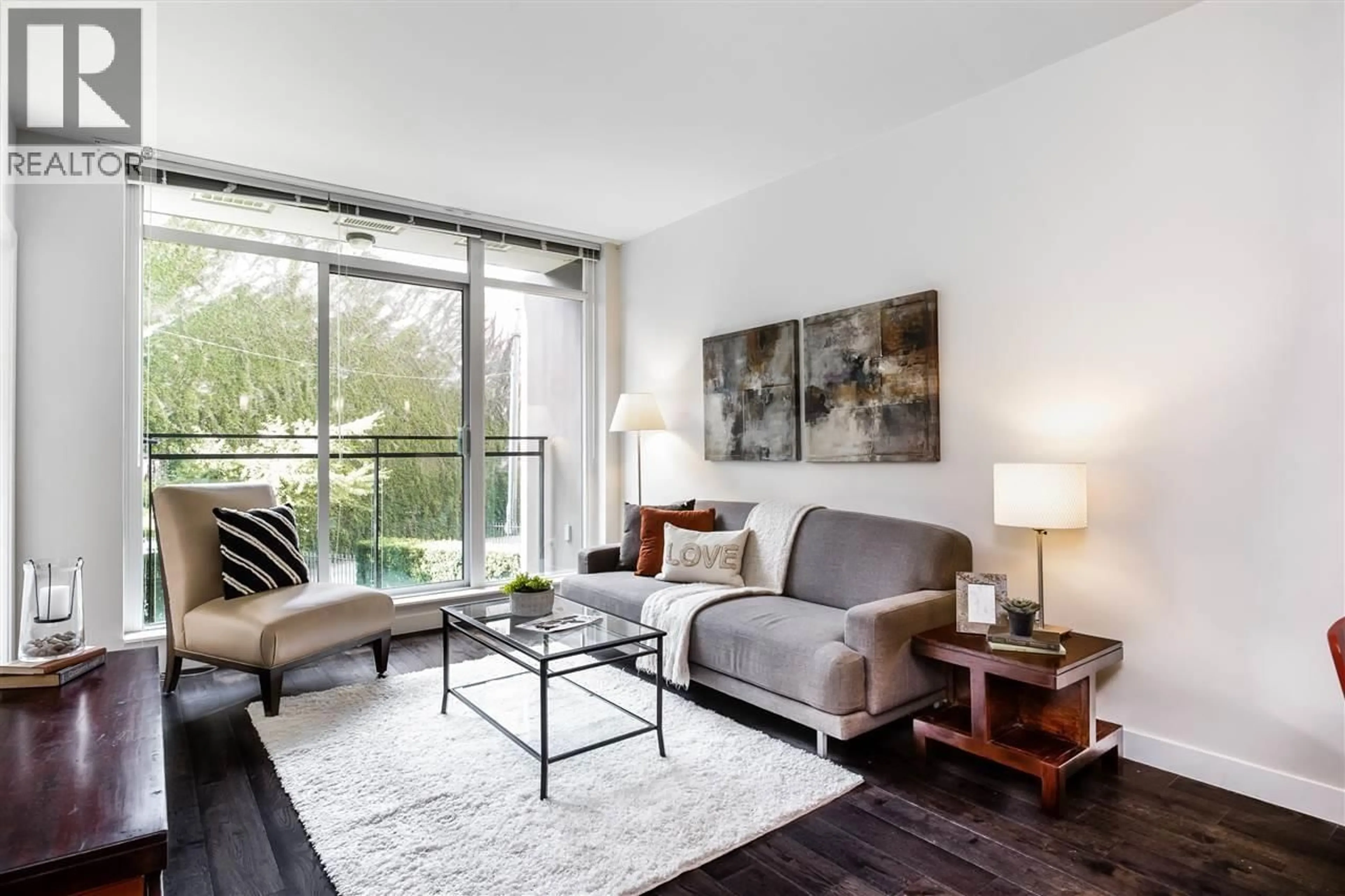 Living room with furniture, wood/laminate floor for 208 - 2321 SCOTIA STREET, Vancouver British Columbia V5T0A8
