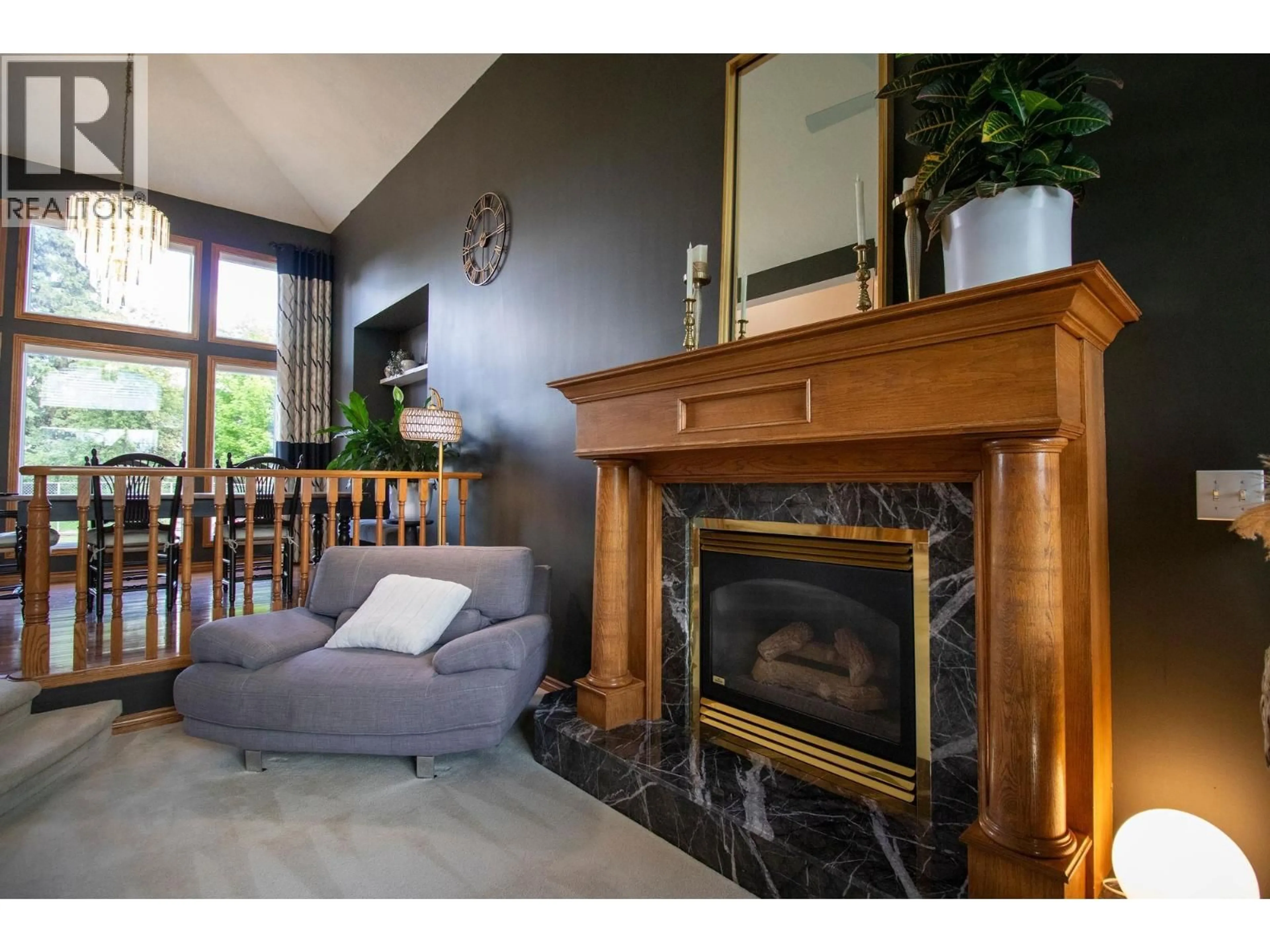 Living room with furniture, wood/laminate floor for 10607 107 STREET, Fort St. John British Columbia V1J5N7