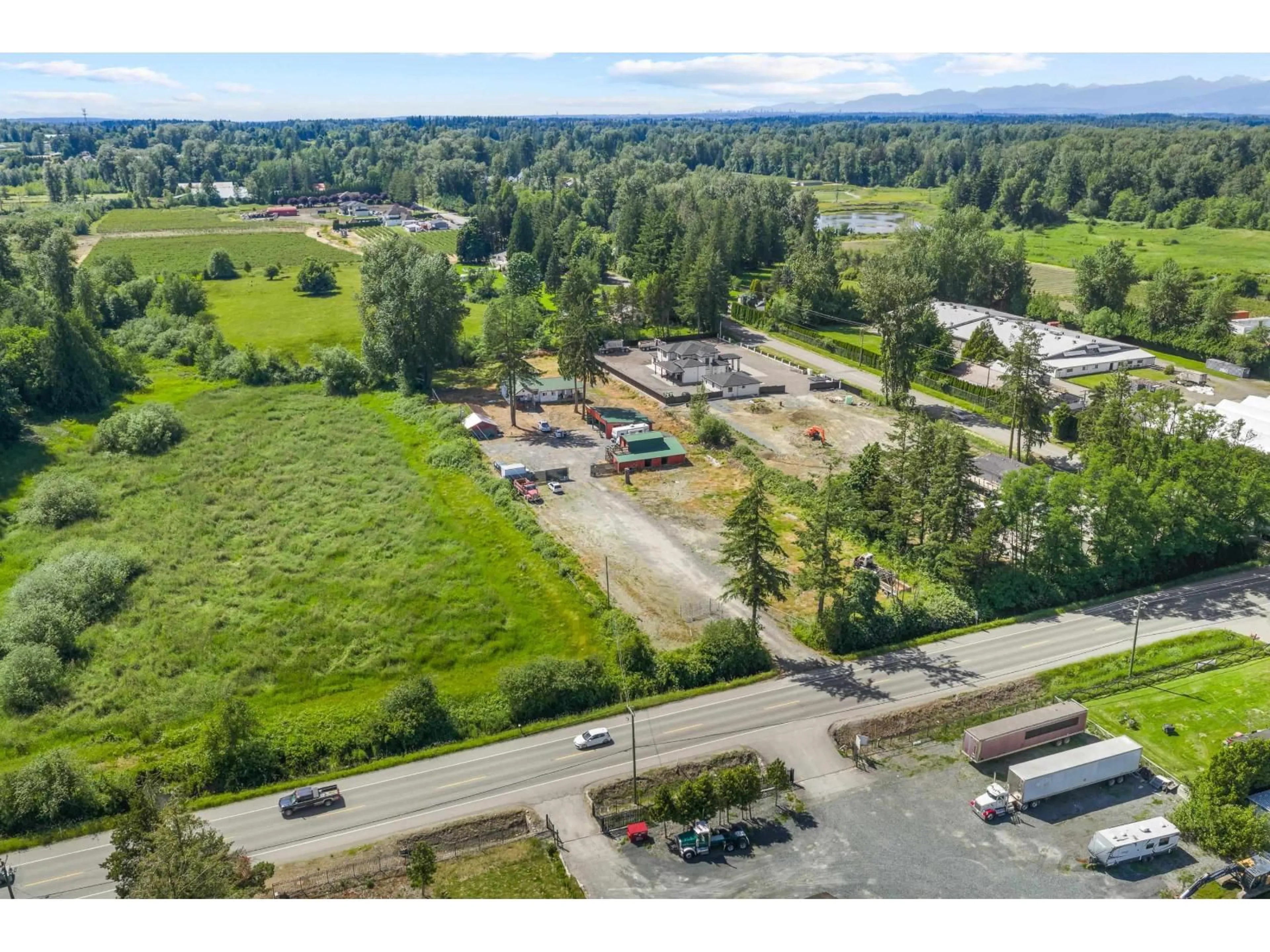 A pic from outside/outdoor area/front of a property/back of a property/a pic from drone, mountain view for 3555 264 STREET, Langley British Columbia V4W2X3