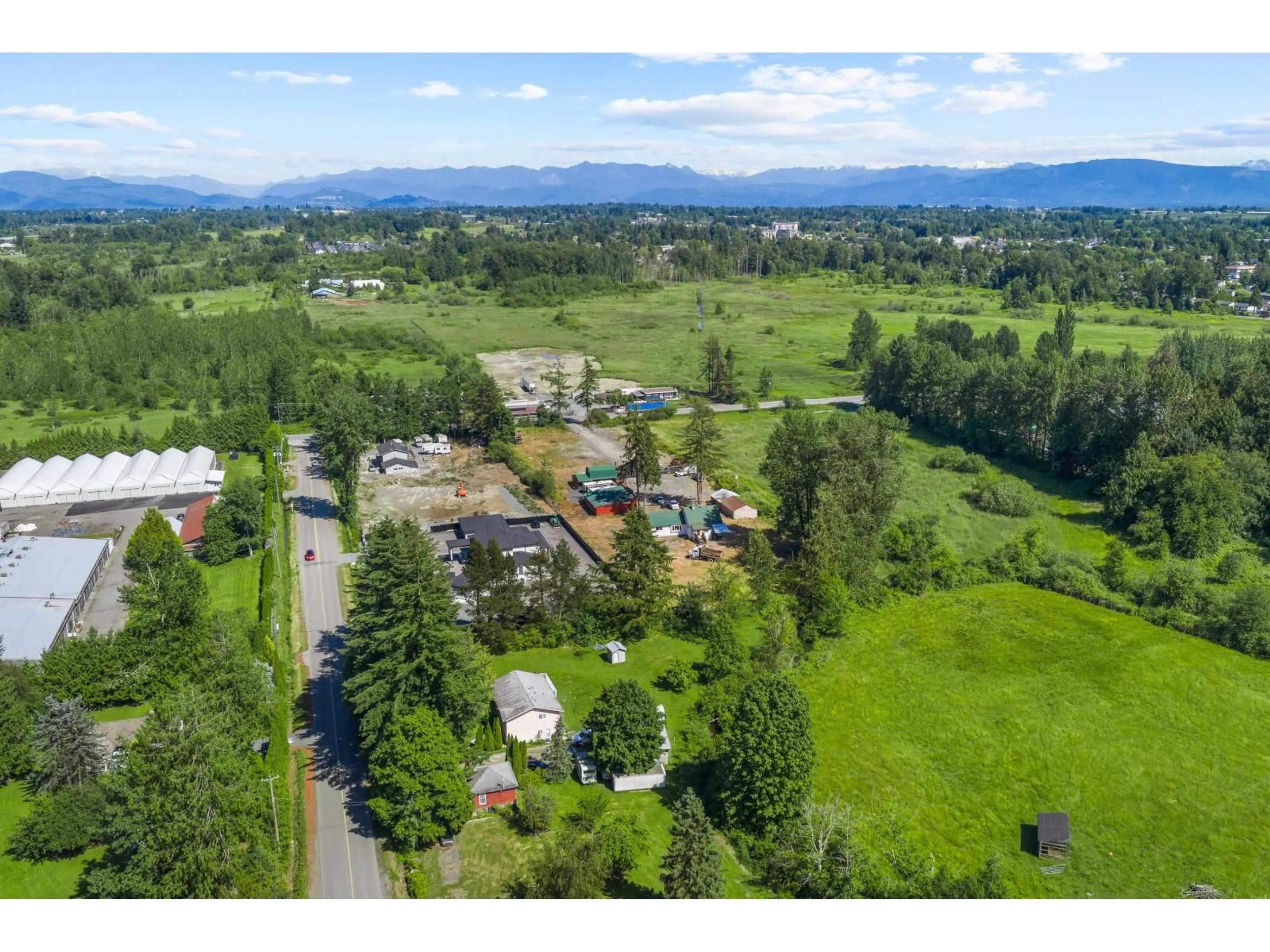A pic from outside/outdoor area/front of a property/back of a property/a pic from drone, mountain view for 3555 264 STREET, Langley British Columbia V4W2X3