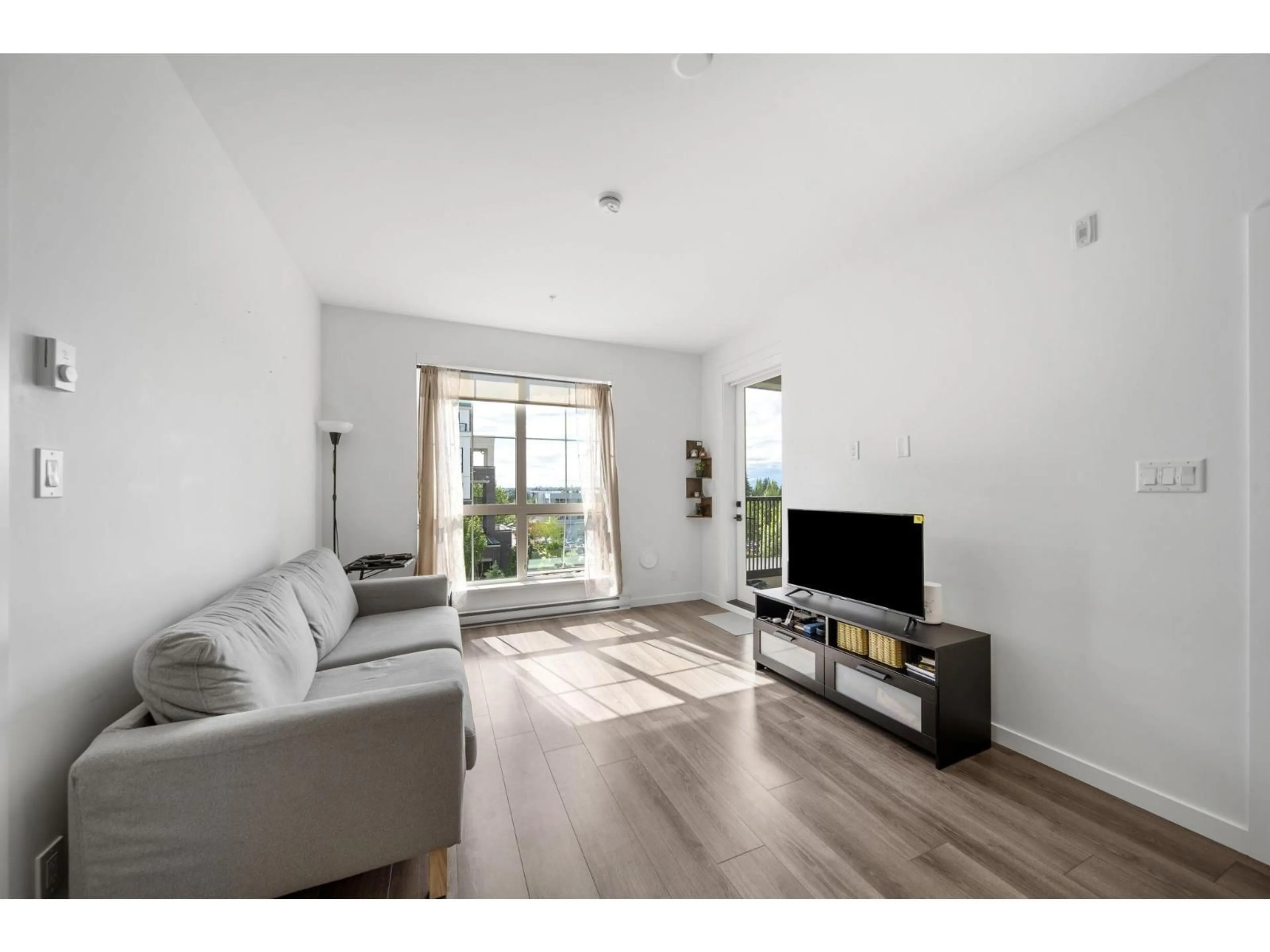 Living room with furniture, wood/laminate floor for B315 - 20078 85 AVENUE, Langley British Columbia V2Y3Z3