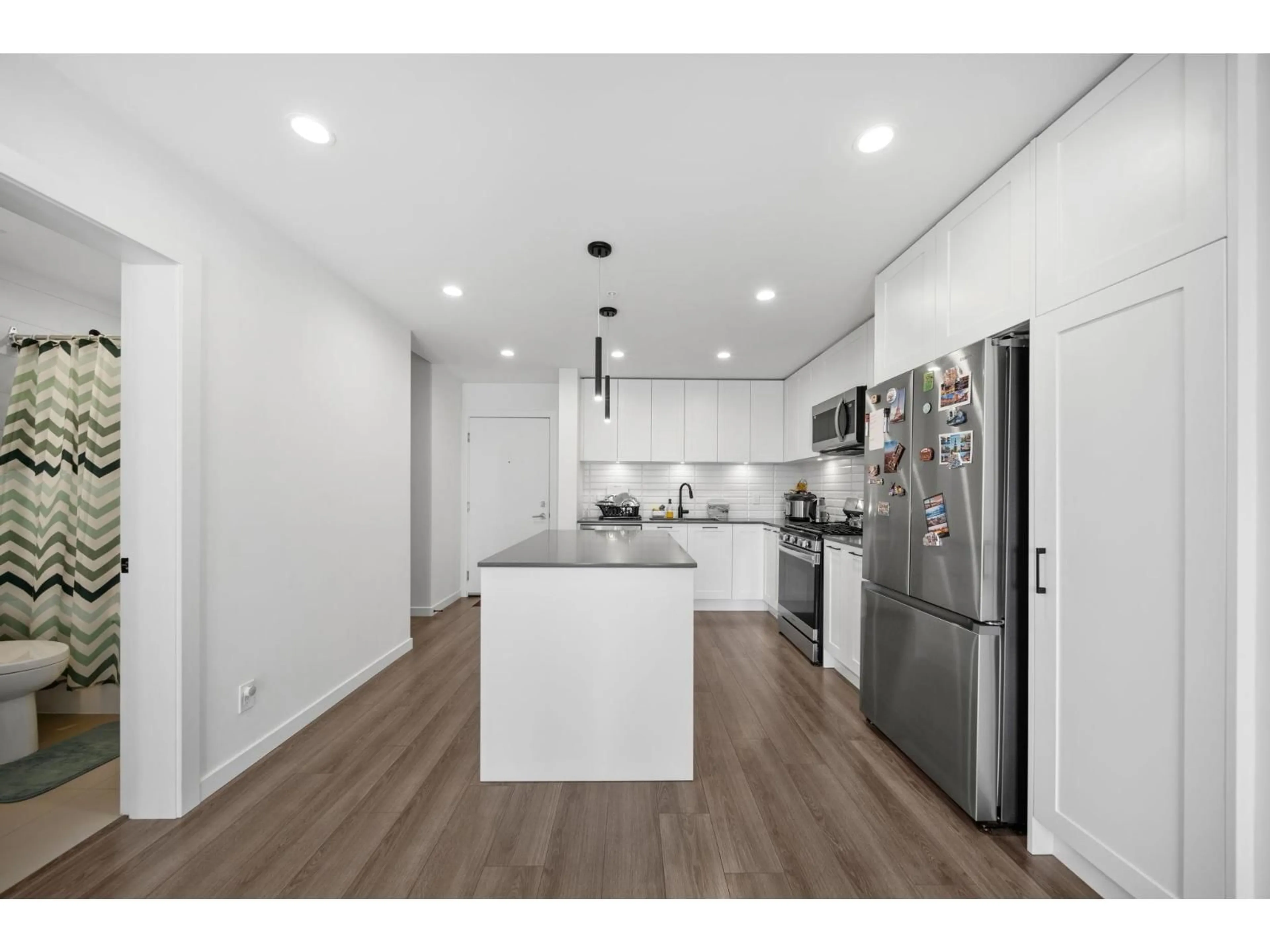 Open concept kitchen, wood/laminate floor for B315 - 20078 85 AVENUE, Langley British Columbia V2Y3Z3