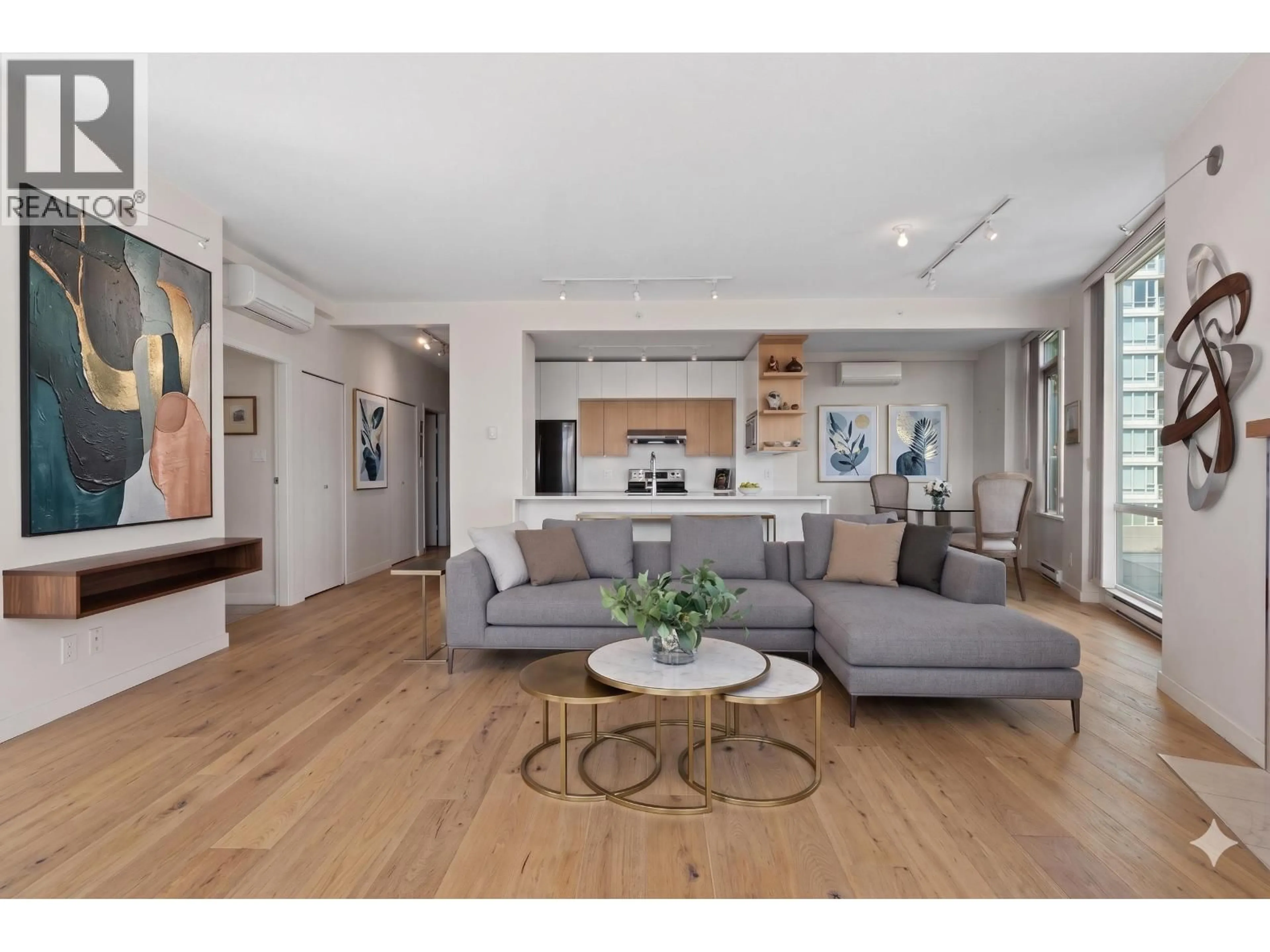 Living room with furniture, unknown for 501 - 1099 MARINASIDE CRESCENT, Vancouver British Columbia V6Z2Z3