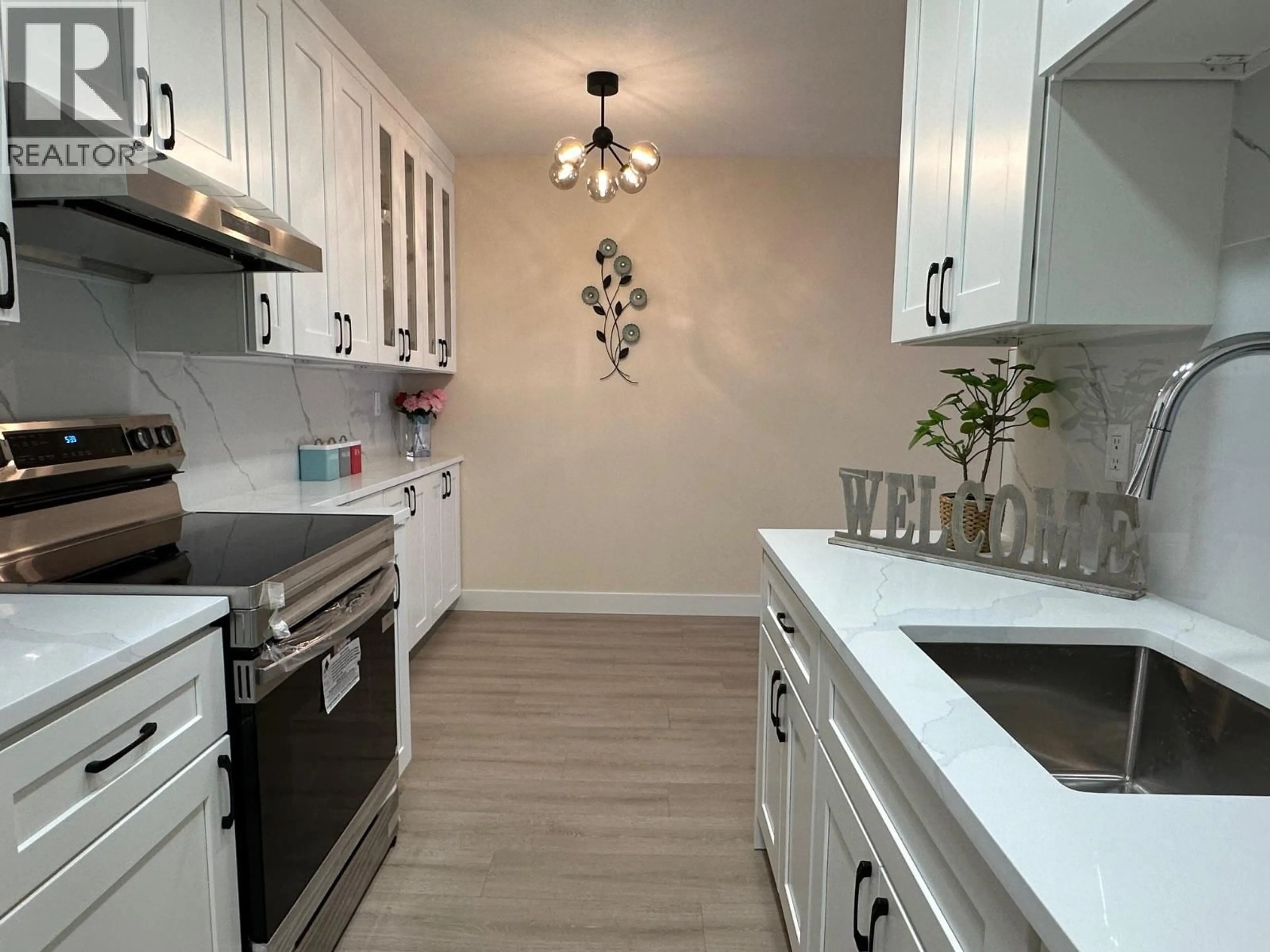 Open concept kitchen, wood/laminate floor for 401 - 4941 LOUGHEED HIGHWAY, Burnaby British Columbia V5B4S6