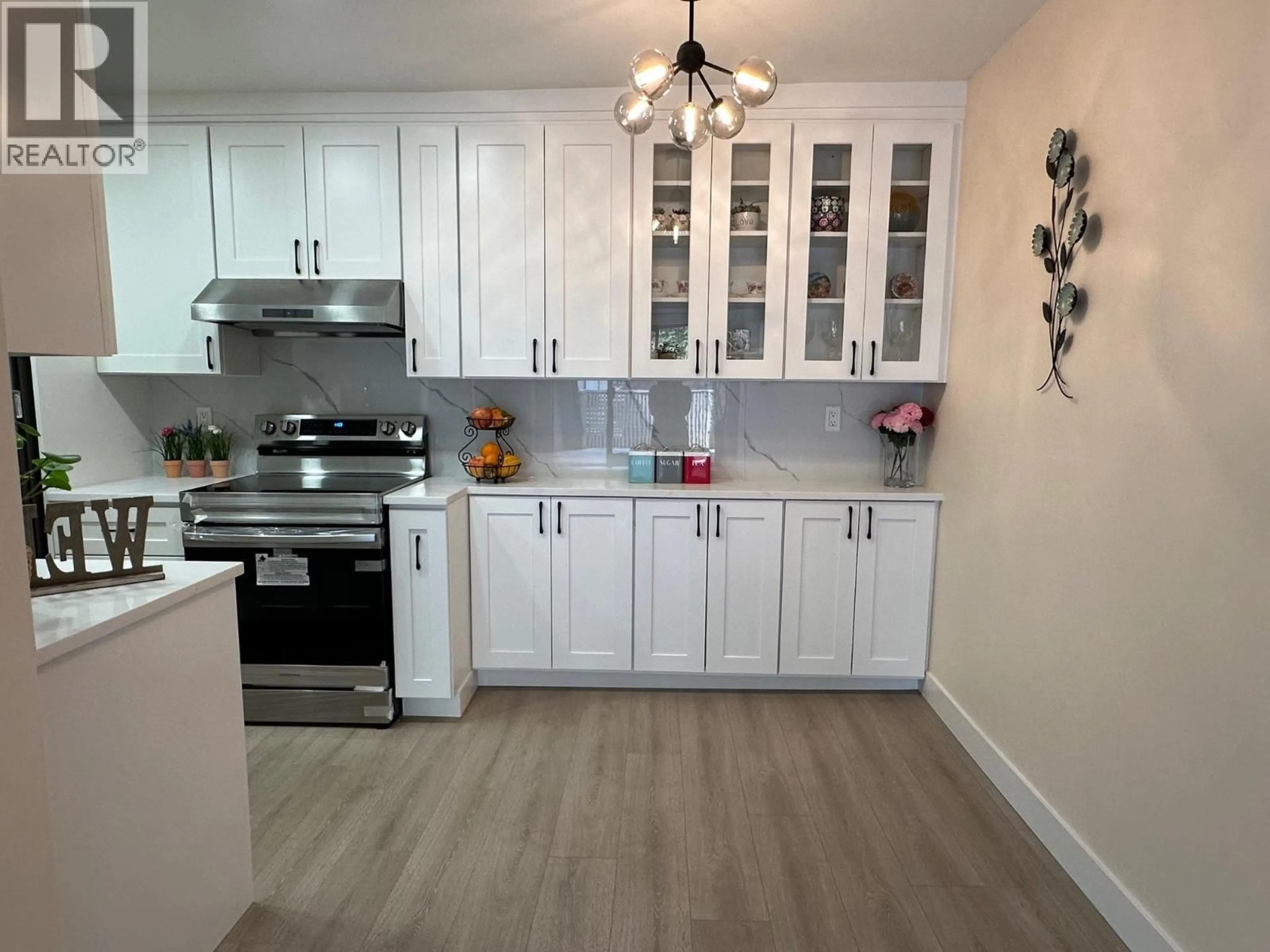 Open concept kitchen, wood/laminate floor for 401 - 4941 LOUGHEED HIGHWAY, Burnaby British Columbia V5B4S6