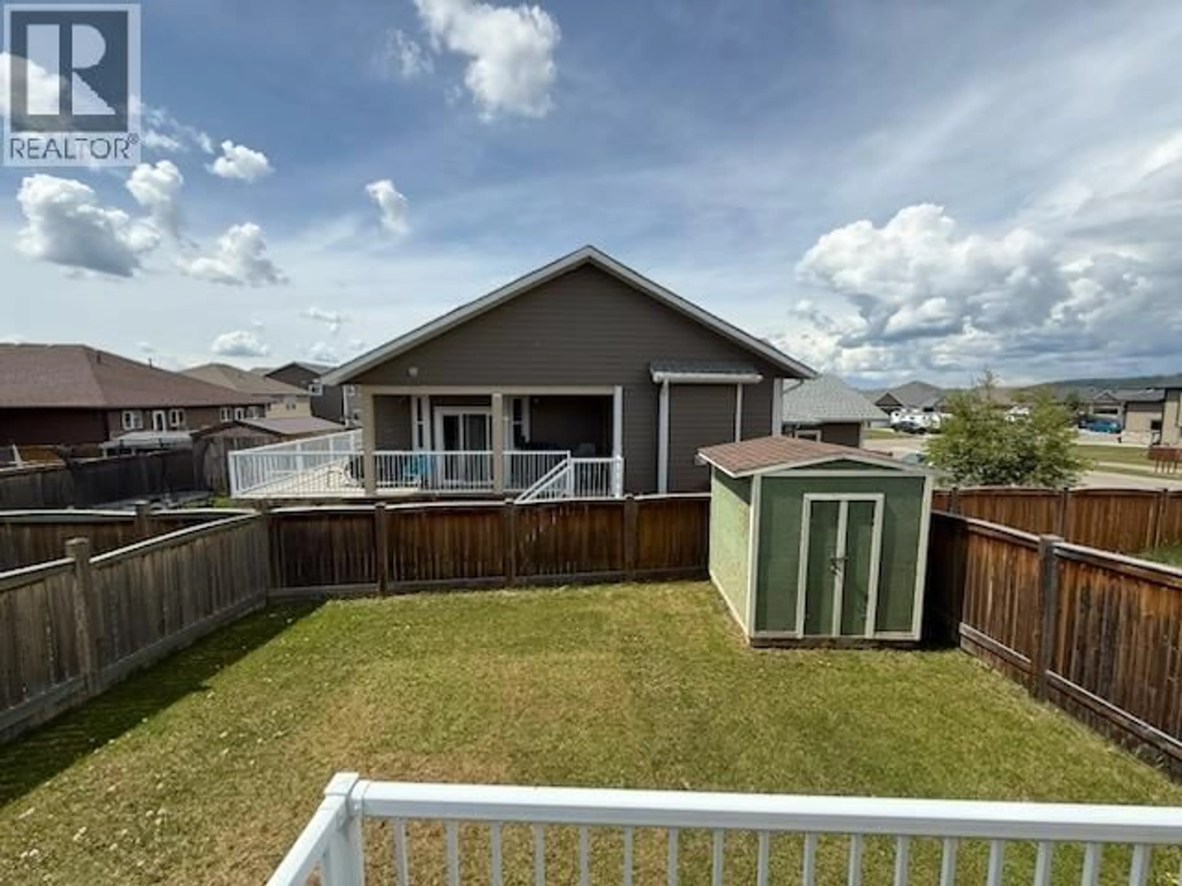 A pic from outside/outdoor area/front of a property/back of a property/a pic from drone, mountain view for 10420 109 STREET, Fort St. John British Columbia V1J0J3
