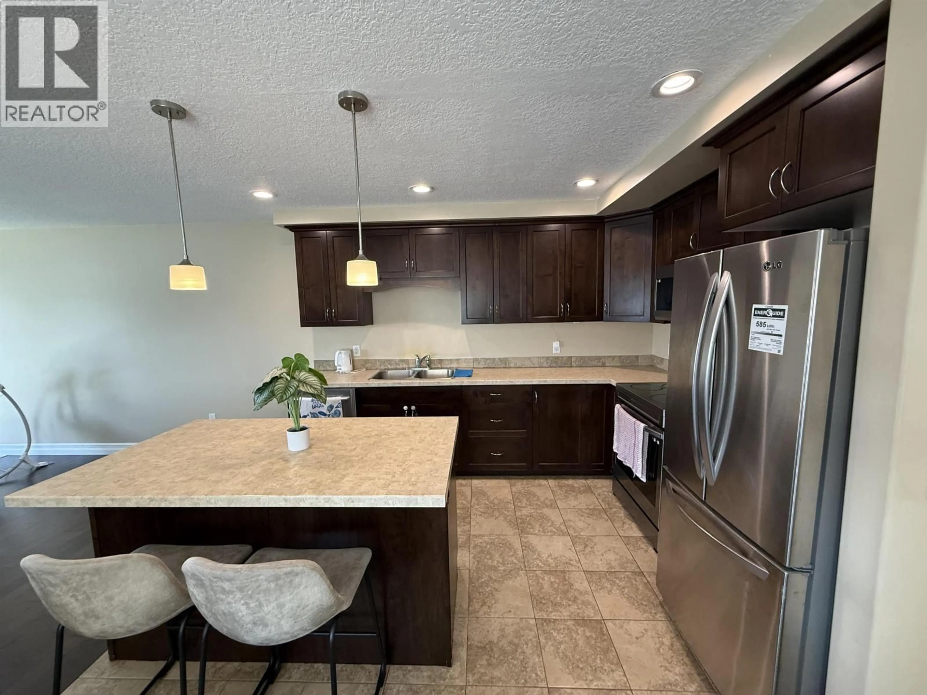 Open concept kitchen, ceramic/tile floor for 10420 109 STREET, Fort St. John British Columbia V1J0J3