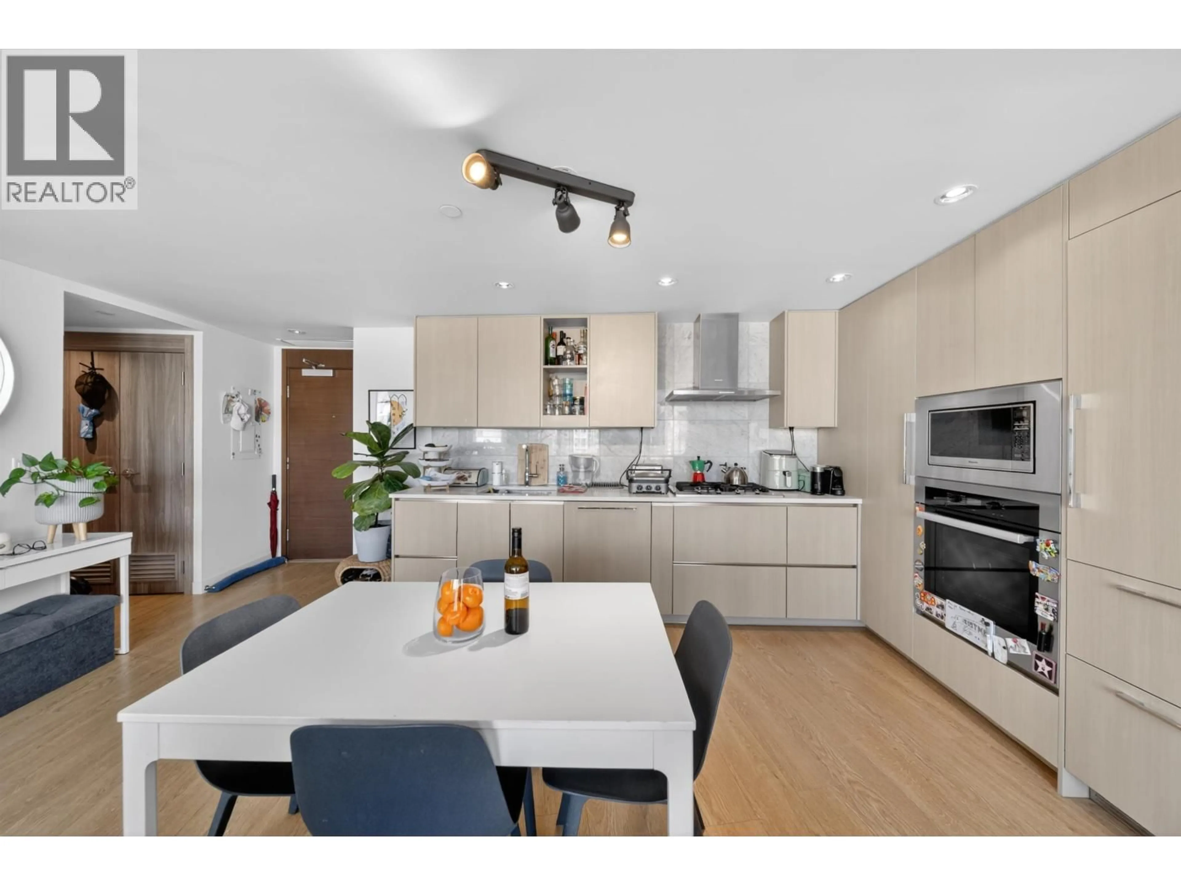 Open concept kitchen, wood/laminate floor for 2001 - 89 NELSON STREET, Vancouver British Columbia V6Z0E7