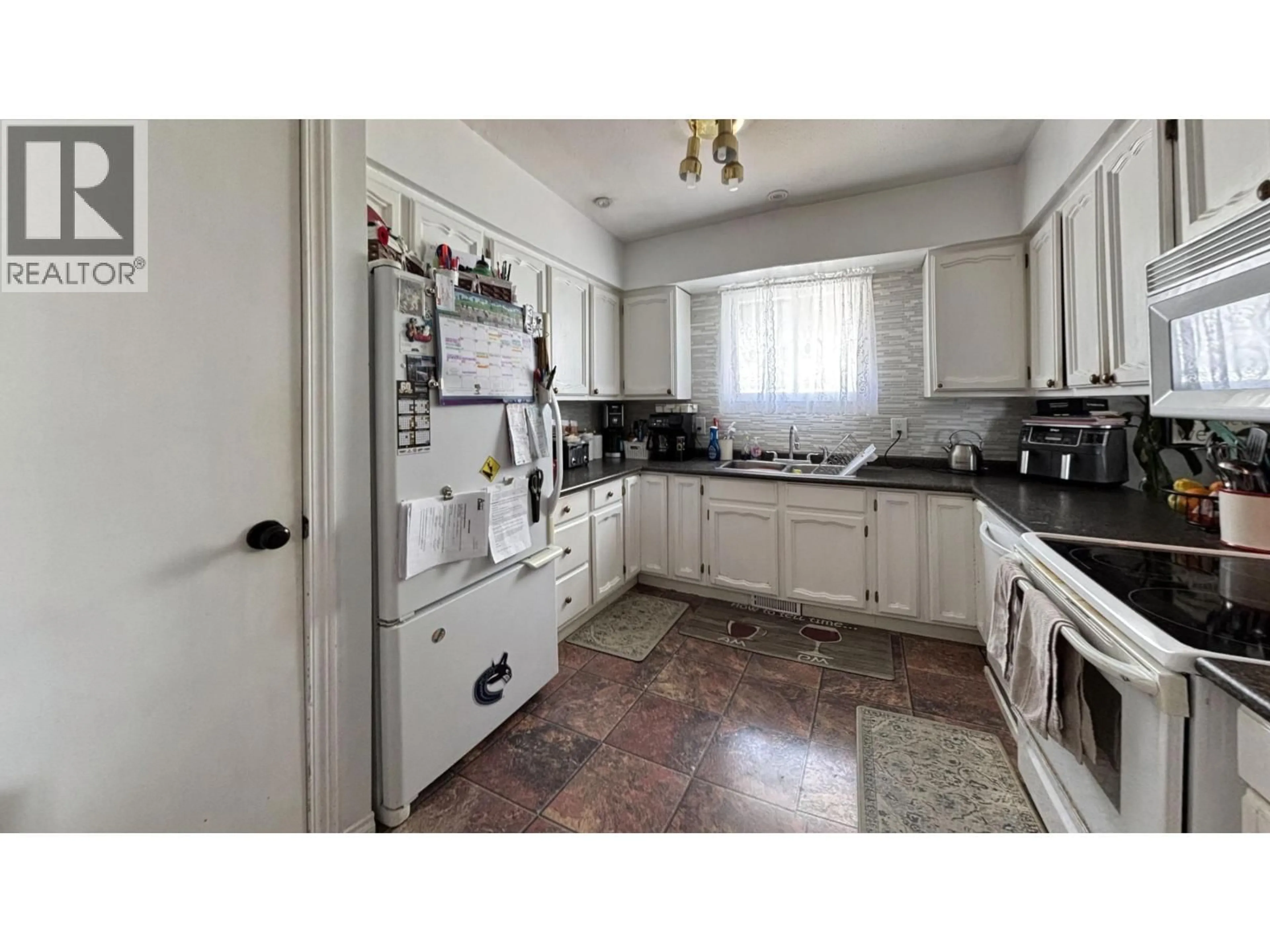 Standard kitchen, ceramic/tile floor for 8924 88 STREET, Fort St. John British Columbia V1J5B2