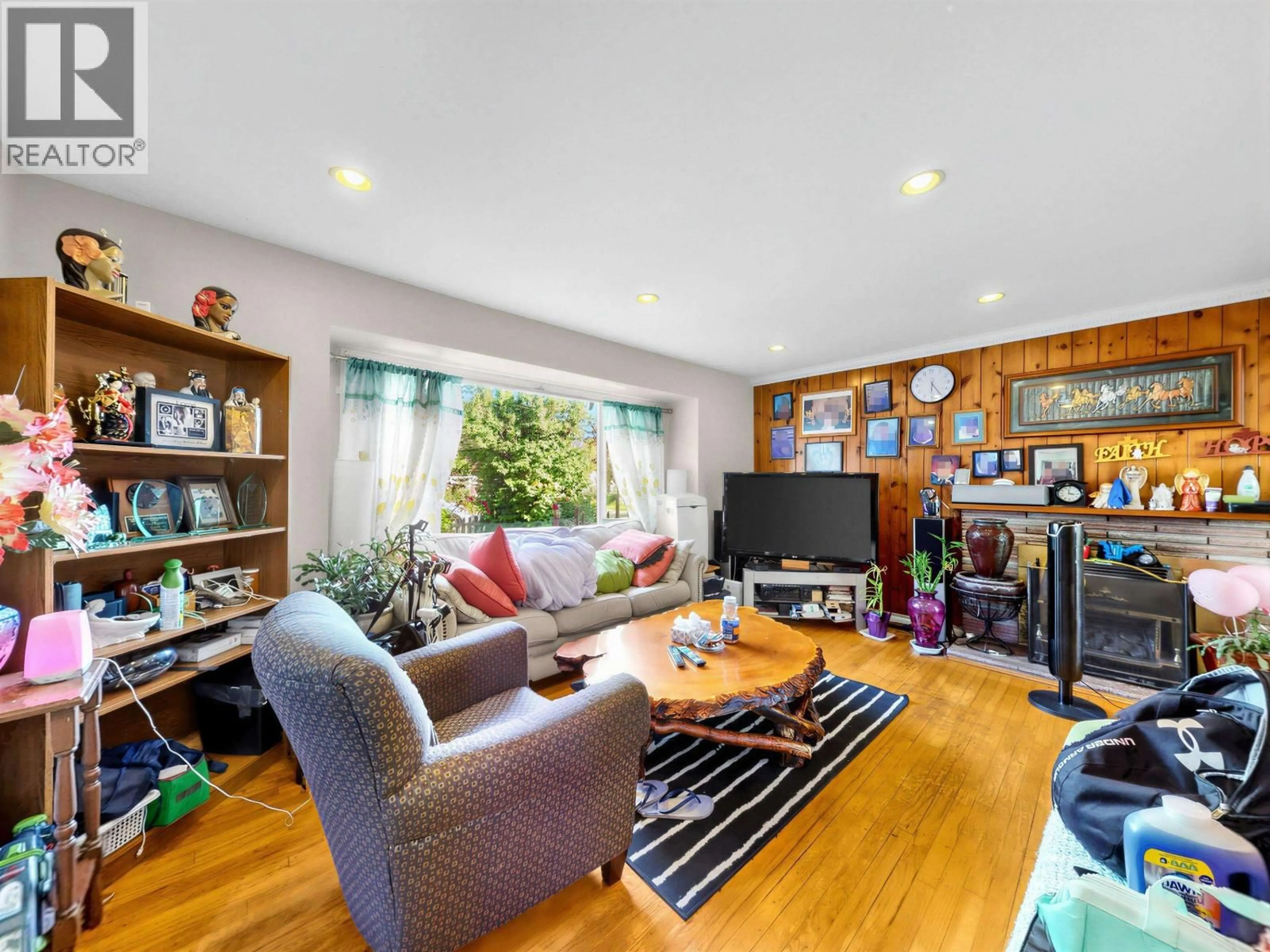 Living room with furniture, wood/laminate floor for 5033 KILLARNEY STREET, Vancouver British Columbia V5R3V8