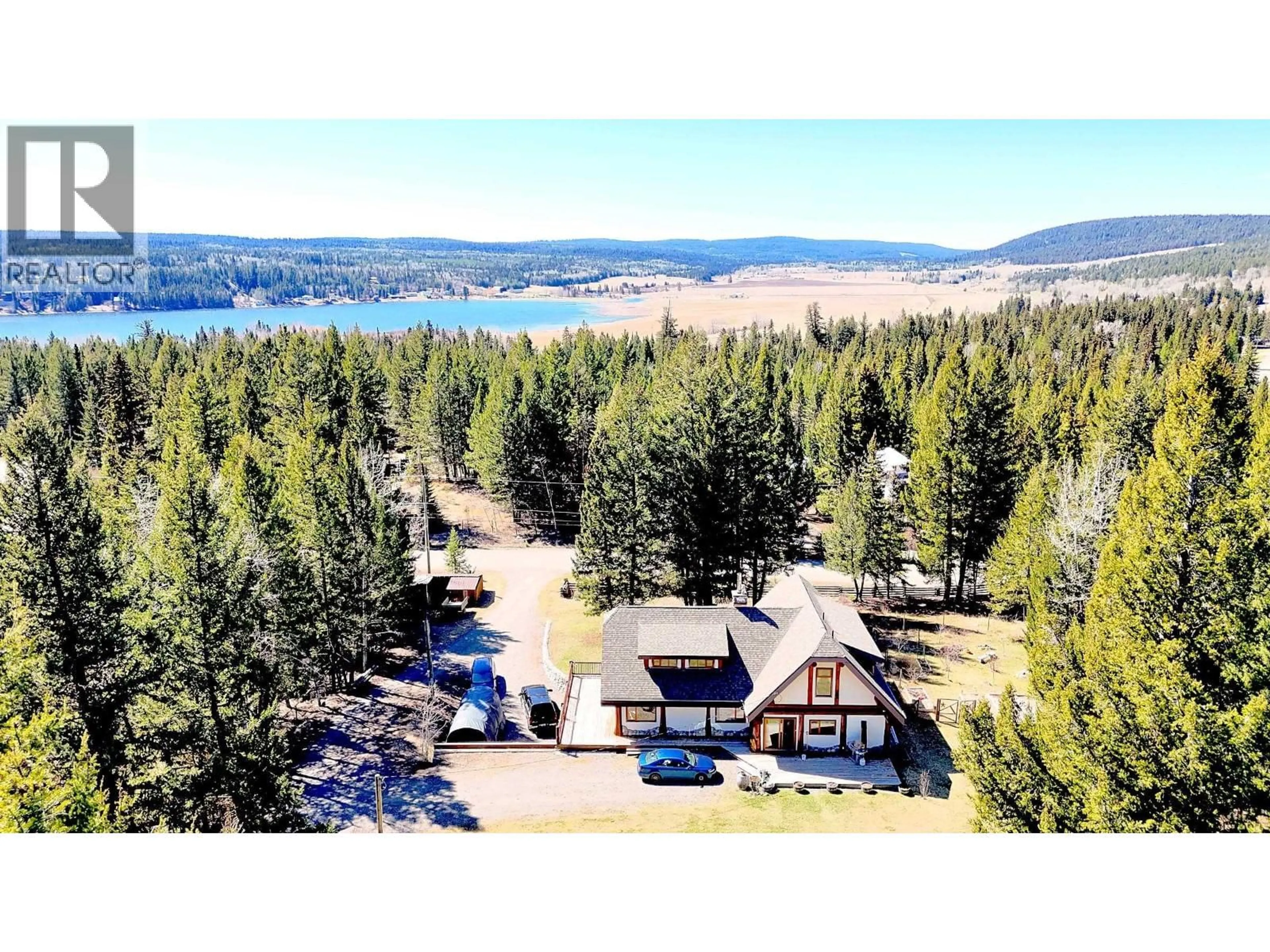 A pic from outside/outdoor area/front of a property/back of a property/a pic from drone, water/lake/river/ocean view for 6419 LAMBLEY ROAD, 100 Mile House British Columbia V0K2E3