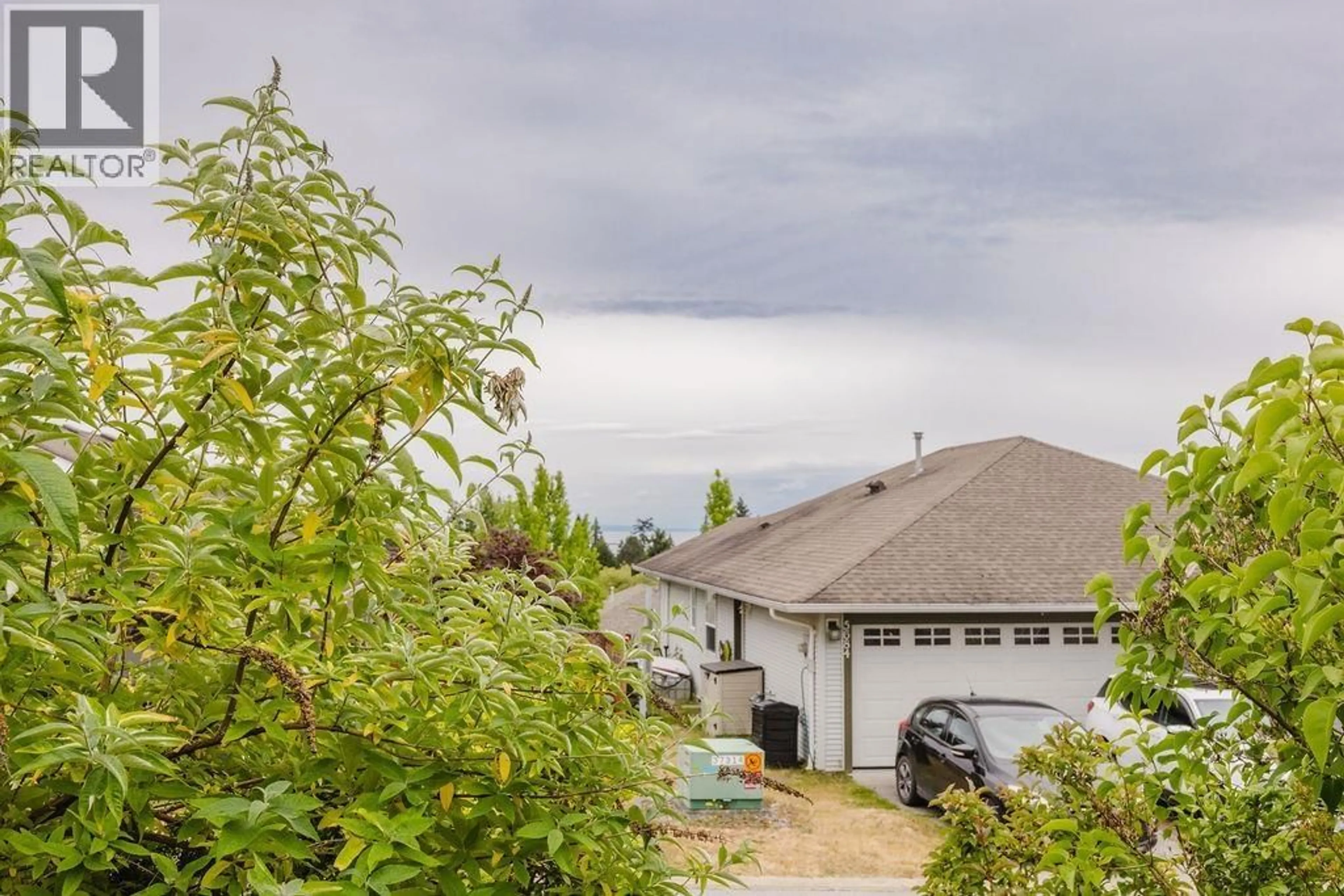 A pic from outside/outdoor area/front of a property/back of a property/a pic from drone, mountain view for 5687 EMILY WAY, Sechelt British Columbia V7Z0N5