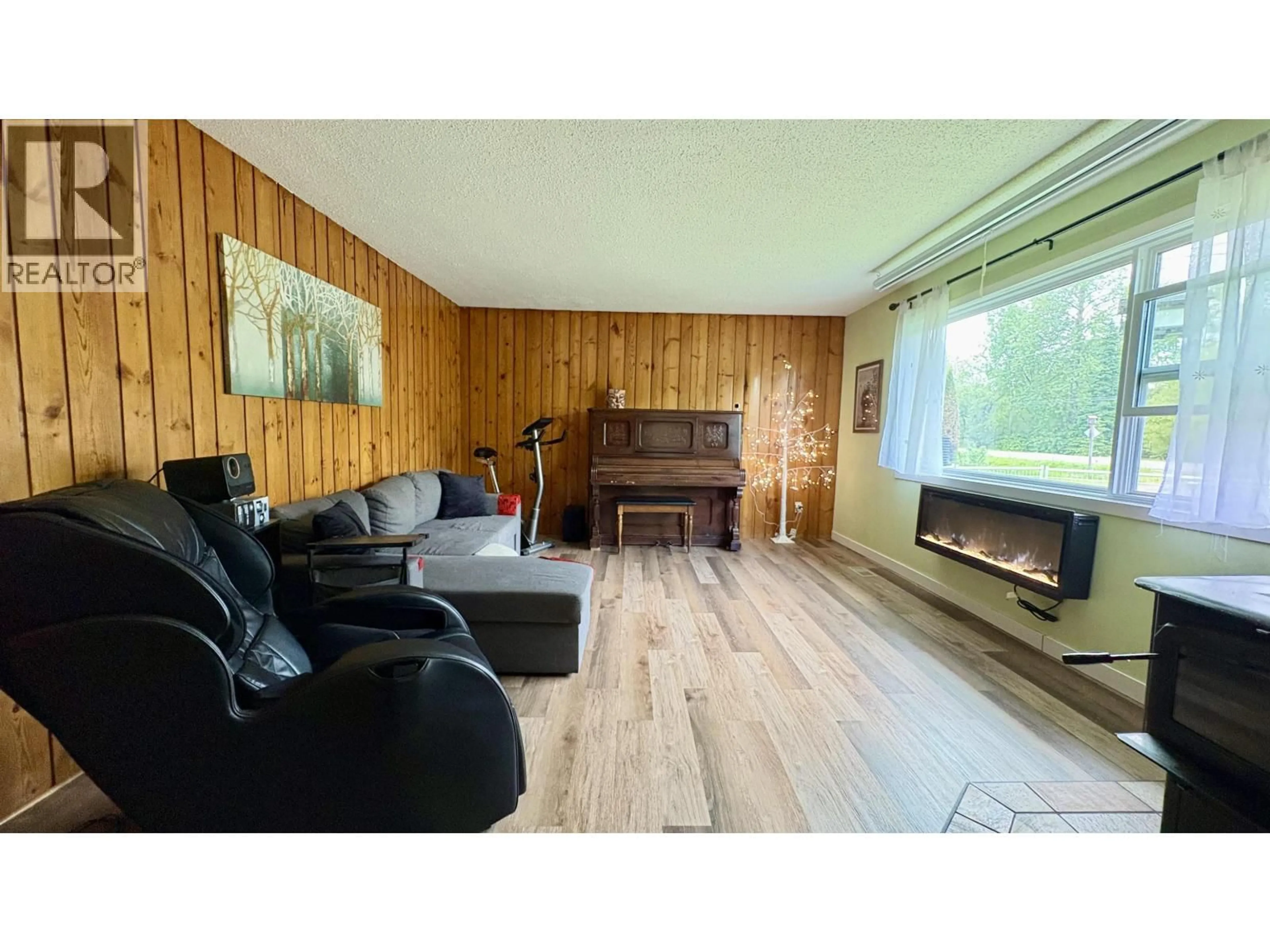 Living room with furniture, wood/laminate floor for 14500 UPPER FRASER ROAD, Prince George British Columbia V2K5C9