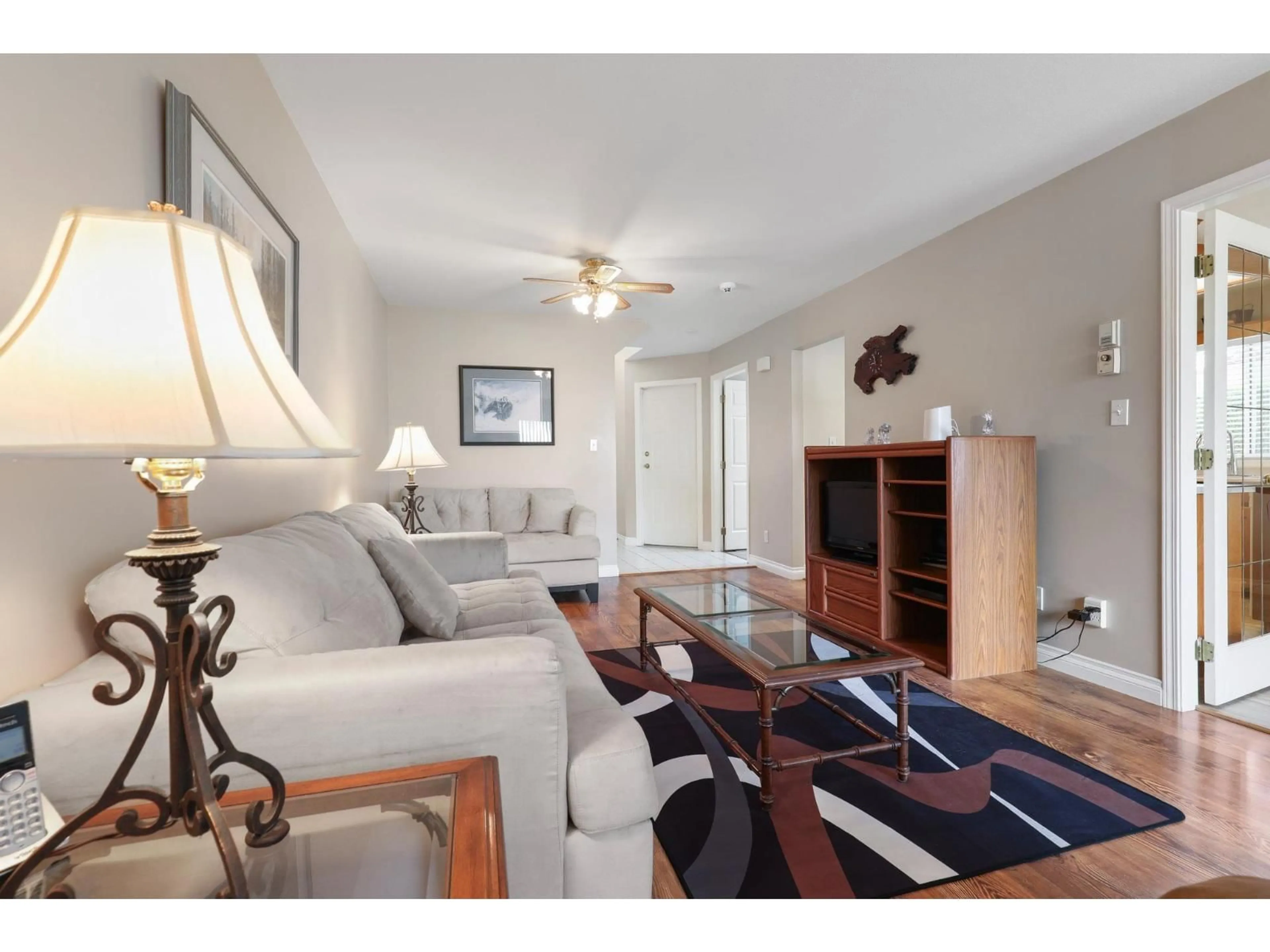 Living room with furniture, wood/laminate floor for 1 - 45365 WATSON ROAD, Chilliwack British Columbia V2R2H5
