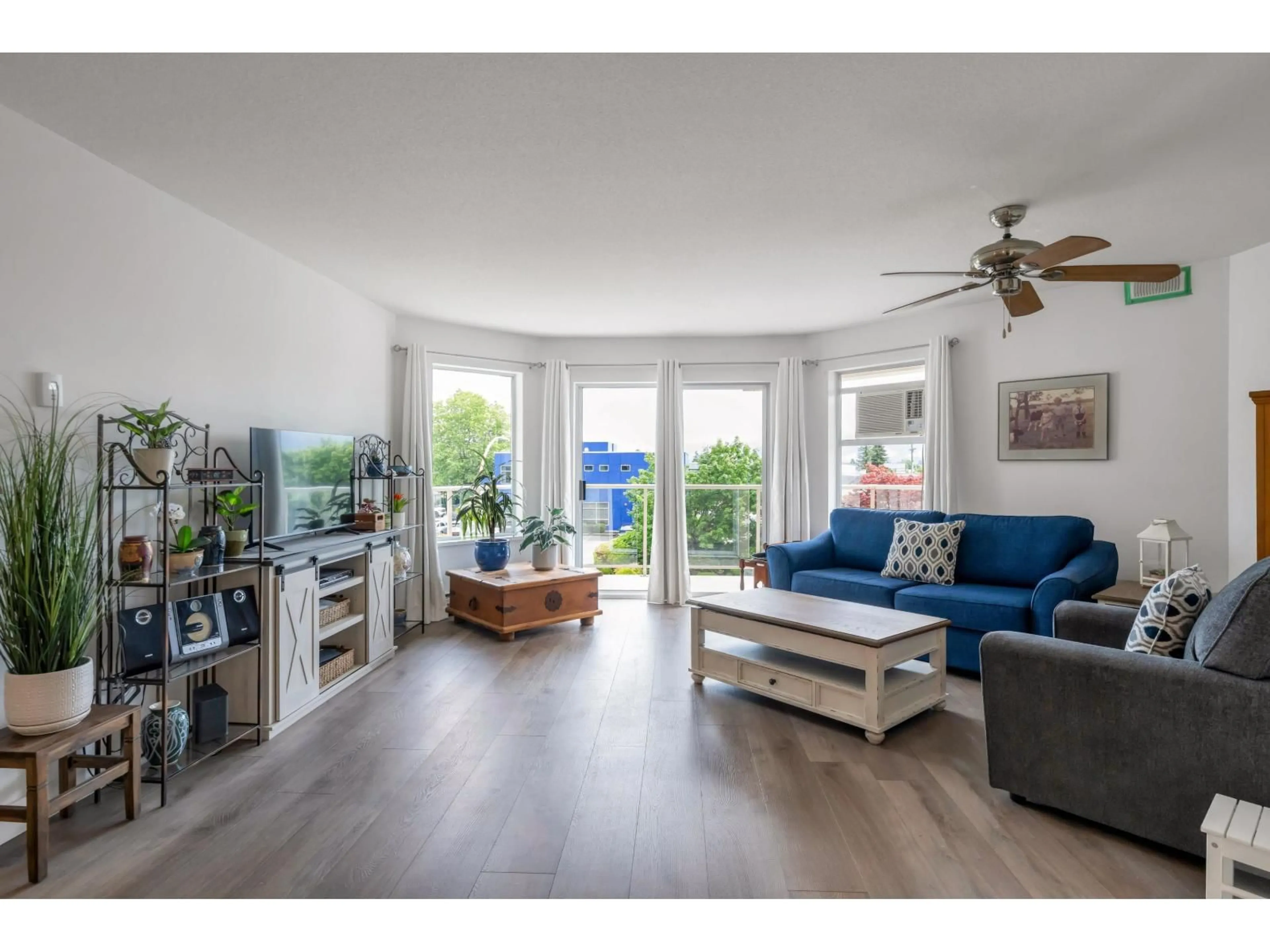 Living room with furniture, wood/laminate floor for 201 - 7685 AMBER DRIVE, Chilliwack British Columbia V2R3P3